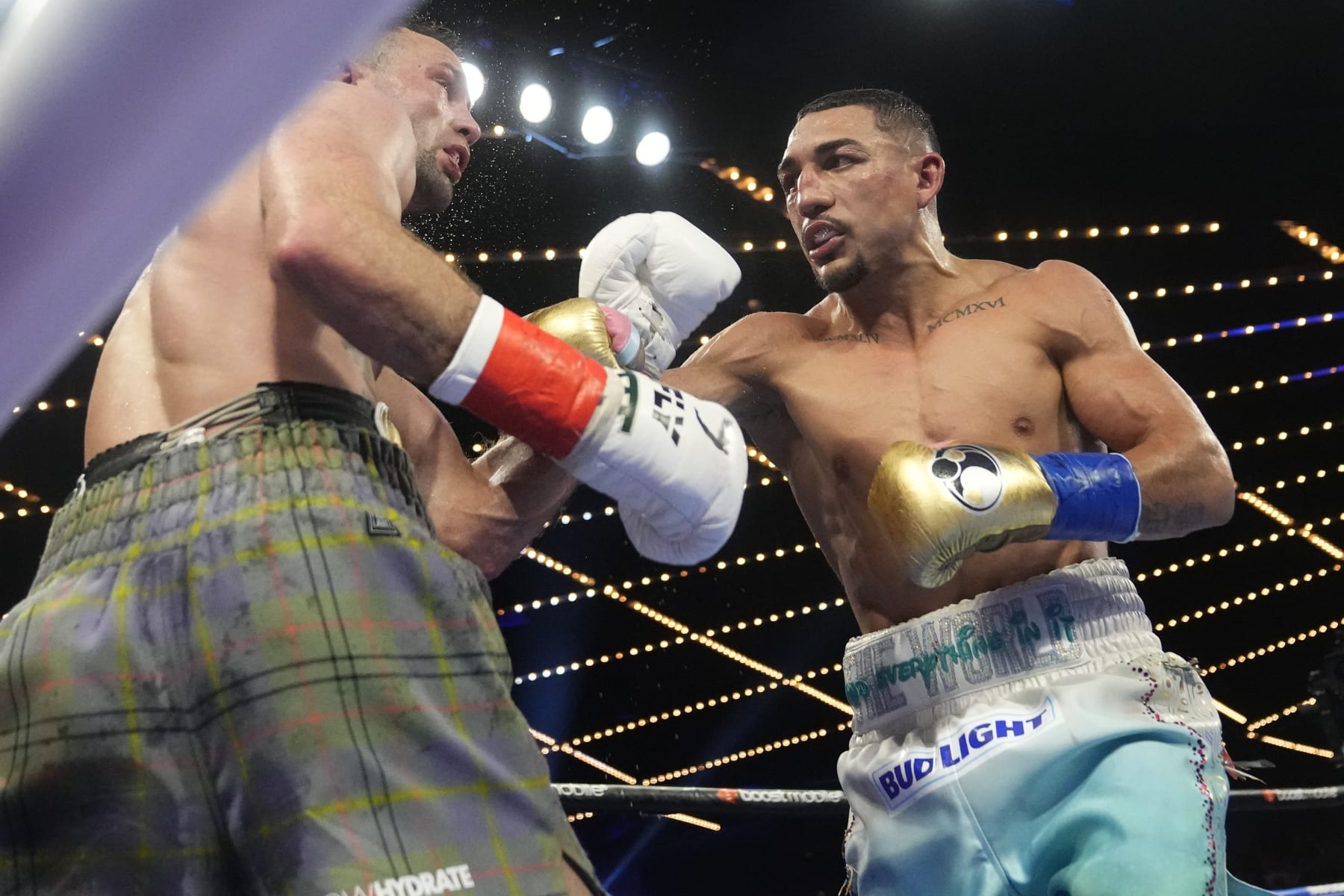Teofimo Lopez, right, punches Scotland's Josh Taylor during the ninth round of a welterweight title bout, Saturday, June 10, 2023 in New York. Lopez won the fight. (AP Photo/Frank Franklin II)