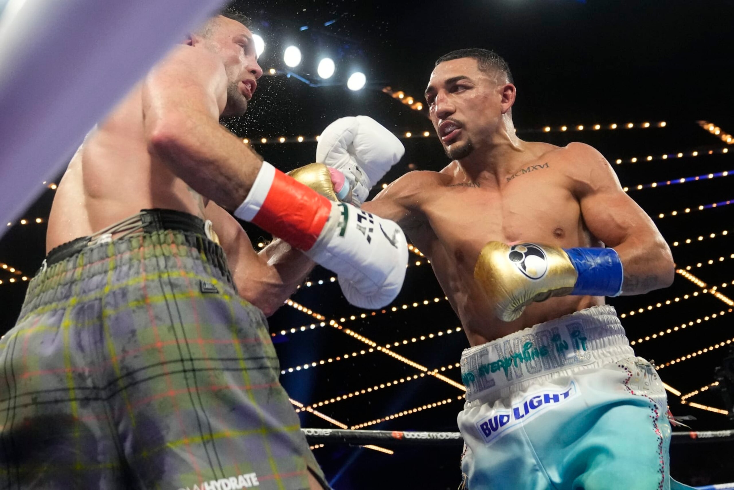 Teofimo Lopez, right, punches Scotland's Josh Taylor during the ninth round of a welterweight title bout, Saturday, June 10, 2023 in New York. Lopez won the fight. (AP Photo/Frank Franklin II)