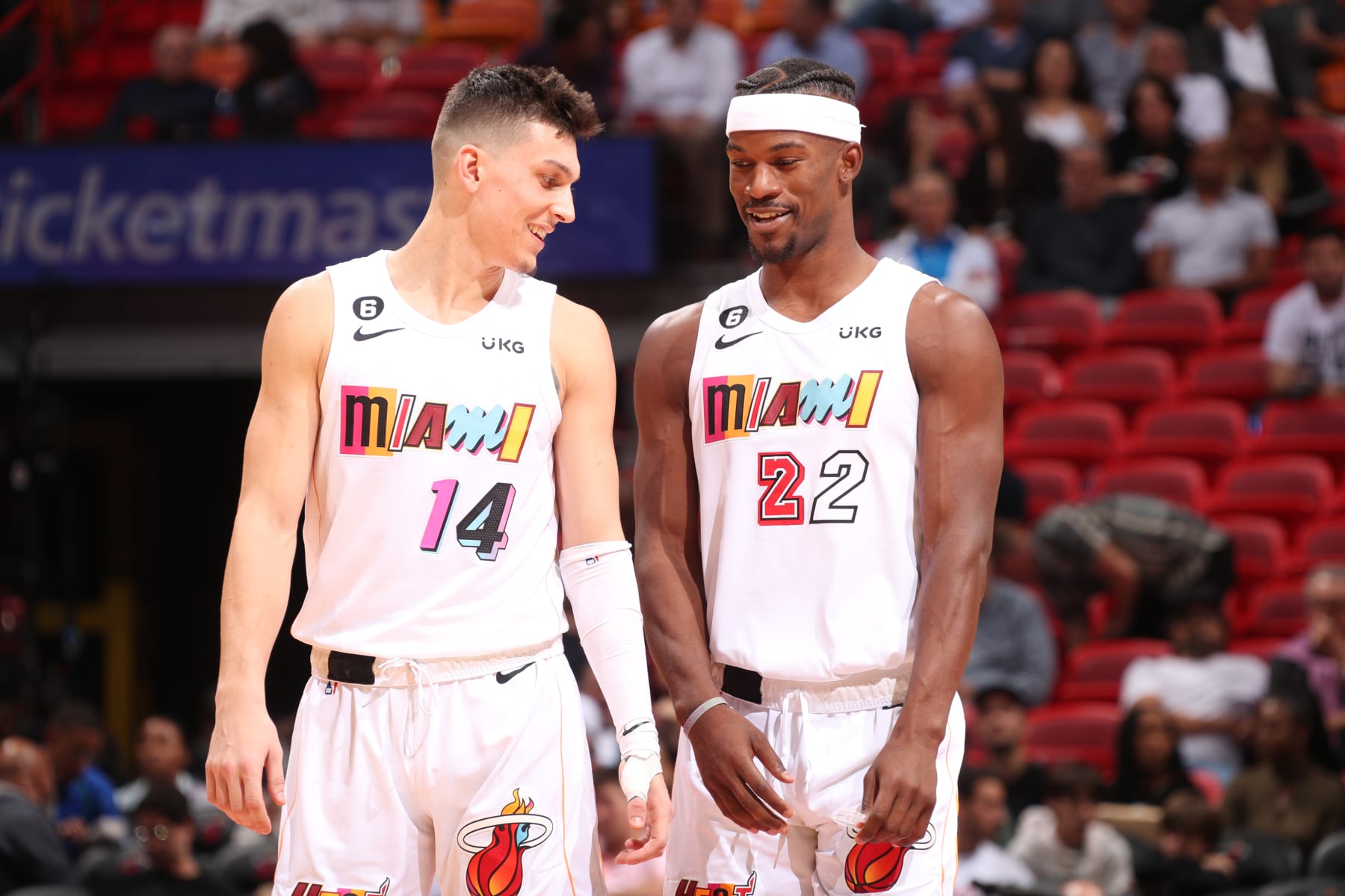 MIAMI, FL - DECEMBER 8: Tyler Herro #14 and Jimmy Butler #22 of the Miami Heat talk during the game against the LA Clippers on December 8, 2022 at FTX Arena in Miami, Florida. NOTE TO USER: User expressly acknowledges and agrees that, by downloading and or using this Photograph, user is consenting to the terms and conditions of the Getty Images License Agreement. Mandatory Copyright Notice: Copyright 2022 NBAE (Photo by Issac Baldizon/NBAE via Getty Images)