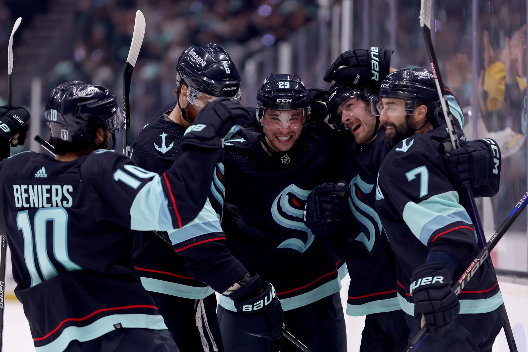 SEATTLE, WASHINGTON - MAY 13: Adam Larsson #6, Matty Beniers #10, Vince Dunn #29, Tye Kartye #52 and Jordan Eberle #7 of the Seattle Kraken celebrate a goal by Kartye against the Dallas Stars during the second period in Game Six of the Second Round of the 2023 Stanley Cup Playoffs at Climate Pledge Arena on May 13, 2023 in Seattle, Washington. (Photo by Steph Chambers/Getty Images)