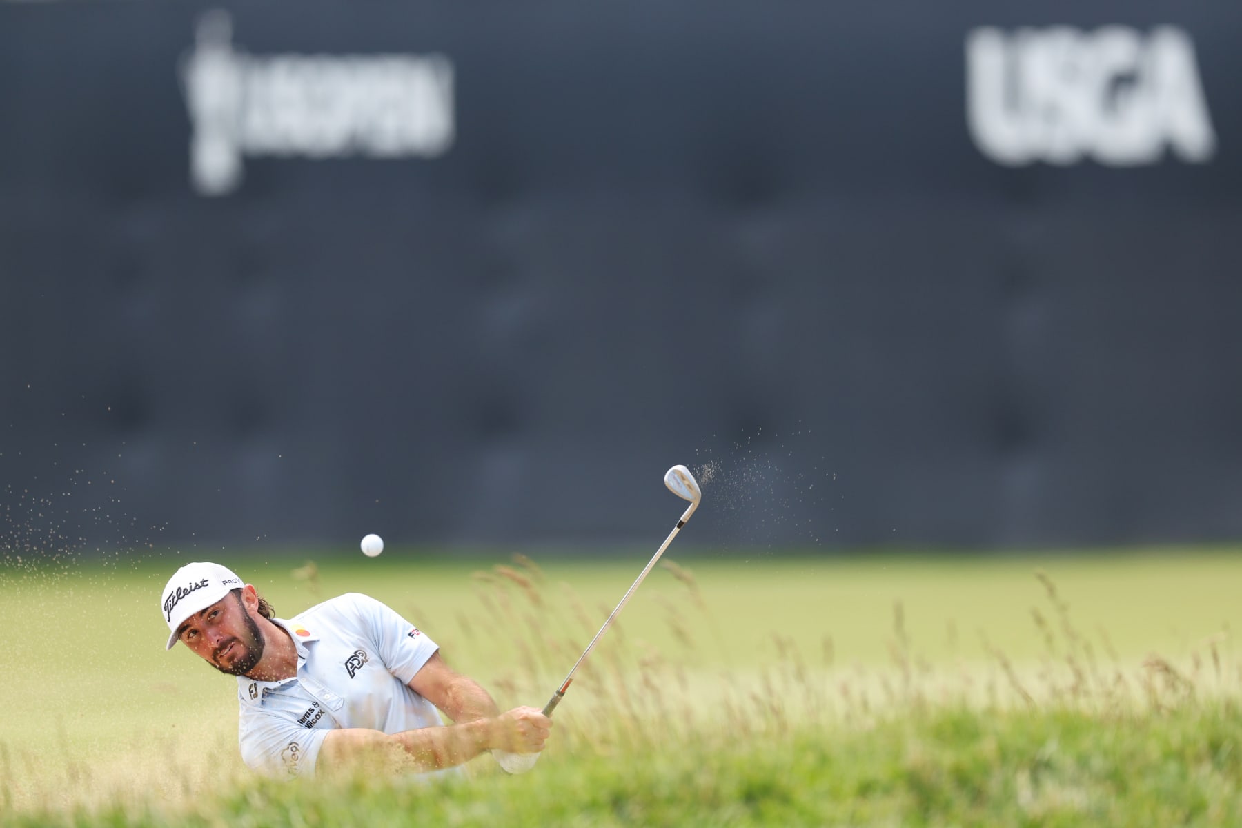 LOS ANGELES, CALIFORNIA - JUNE 12: Max Homa of the United States plays a shot from a bunker on the 18th hole during a practice round prior to the 123rd U.S. Open Championship at The Los Angeles Country Club on June 12, 2023 in Los Angeles, California. (Photo by Andrew Redington/Getty Images)