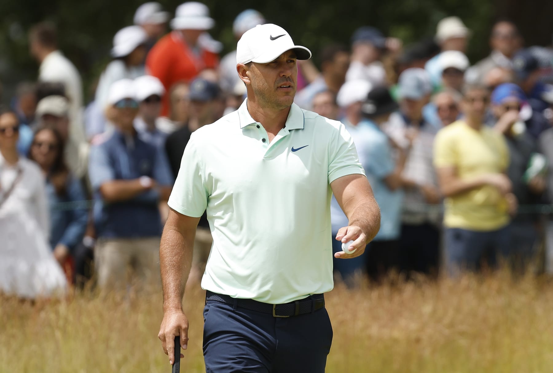 BROOKLINE, MASSACHUSETTS - JUNE 18: Brooks Koepka of the United States waves on the second green during the third round of the 122nd U.S. Open Championship at The Country Club on June 18, 2022 in Brookline, Massachusetts. (Photo by Jared C. Tilton/Getty Images)