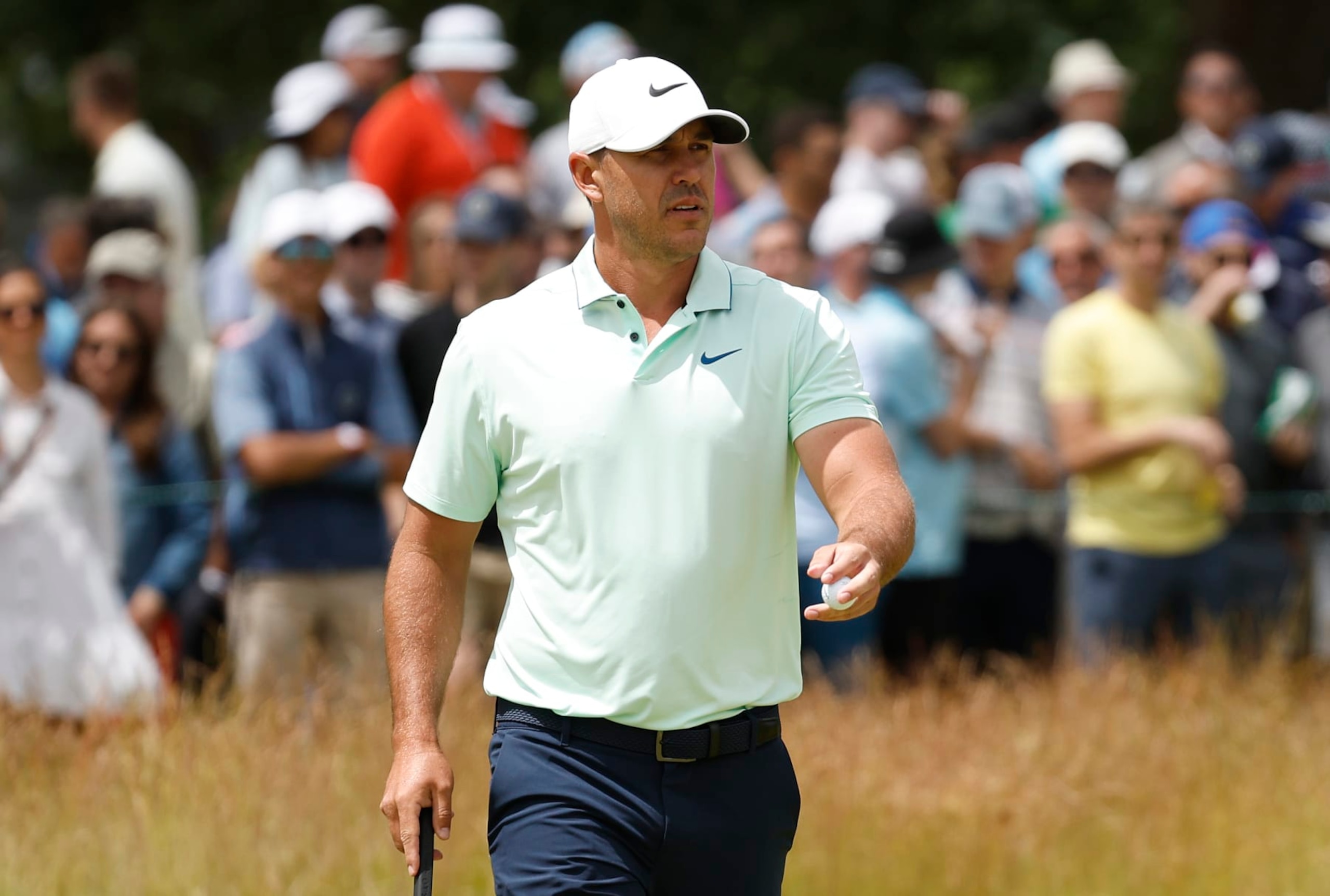BROOKLINE, MASSACHUSETTS - JUNE 18: Brooks Koepka of the United States waves on the second green during the third round of the 122nd U.S. Open Championship at The Country Club on June 18, 2022 in Brookline, Massachusetts. (Photo by Jared C. Tilton/Getty Images)
