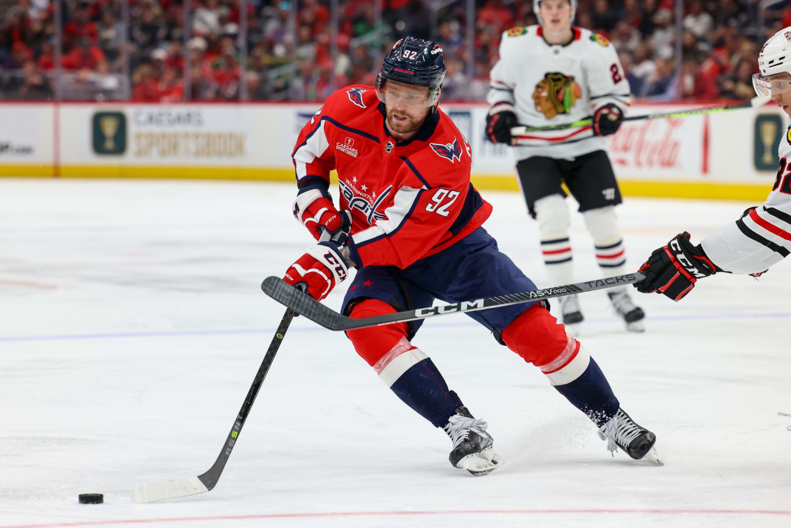 WASHINGTON, DC - MARCH 23: Evgeny Kuznetsov #92 of the Washington Capitals controls the puck during a game against the Chicago Blackhawks at Capital One Arena on March 23, 2023 in Washington, D.C. (Photo by John McCreary/NHLI via Getty Images)