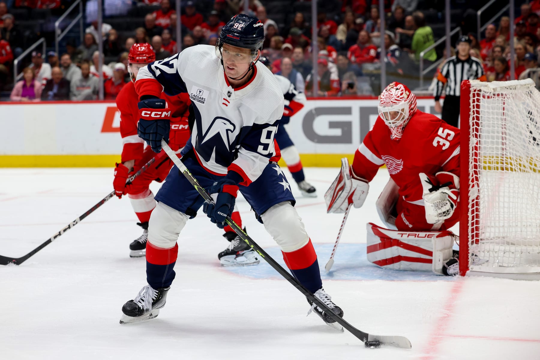WASHINGTON, DC - FEBRUARY 21: Evgeny Kuznetsov #92 of the Washington Capitals looks to make a pass during a game against the Detroit Red Wings at Capital One Arena on February 21, 2023 in Washington, D.C. (Photo by John McCreary/NHLI via Getty Images)