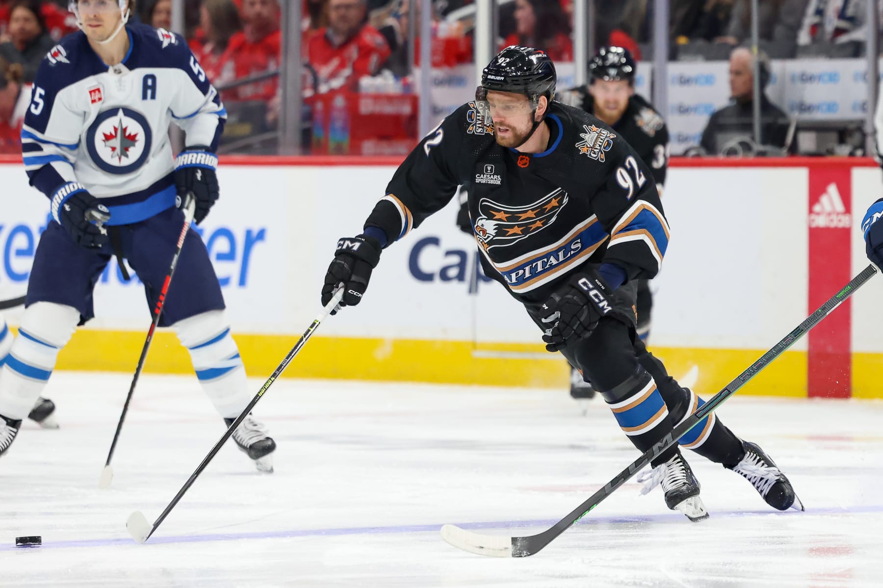 WASHINGTON, DC - DECEMBER 23: Evgeny Kuznetsov #92 of the Washington Capitals skates with the puck during a game against the Winnipeg Jets at Capital One Arena on December 23, 2022 in Washington, D.C. (Photo by John McCreary/NHLI via Getty Images)