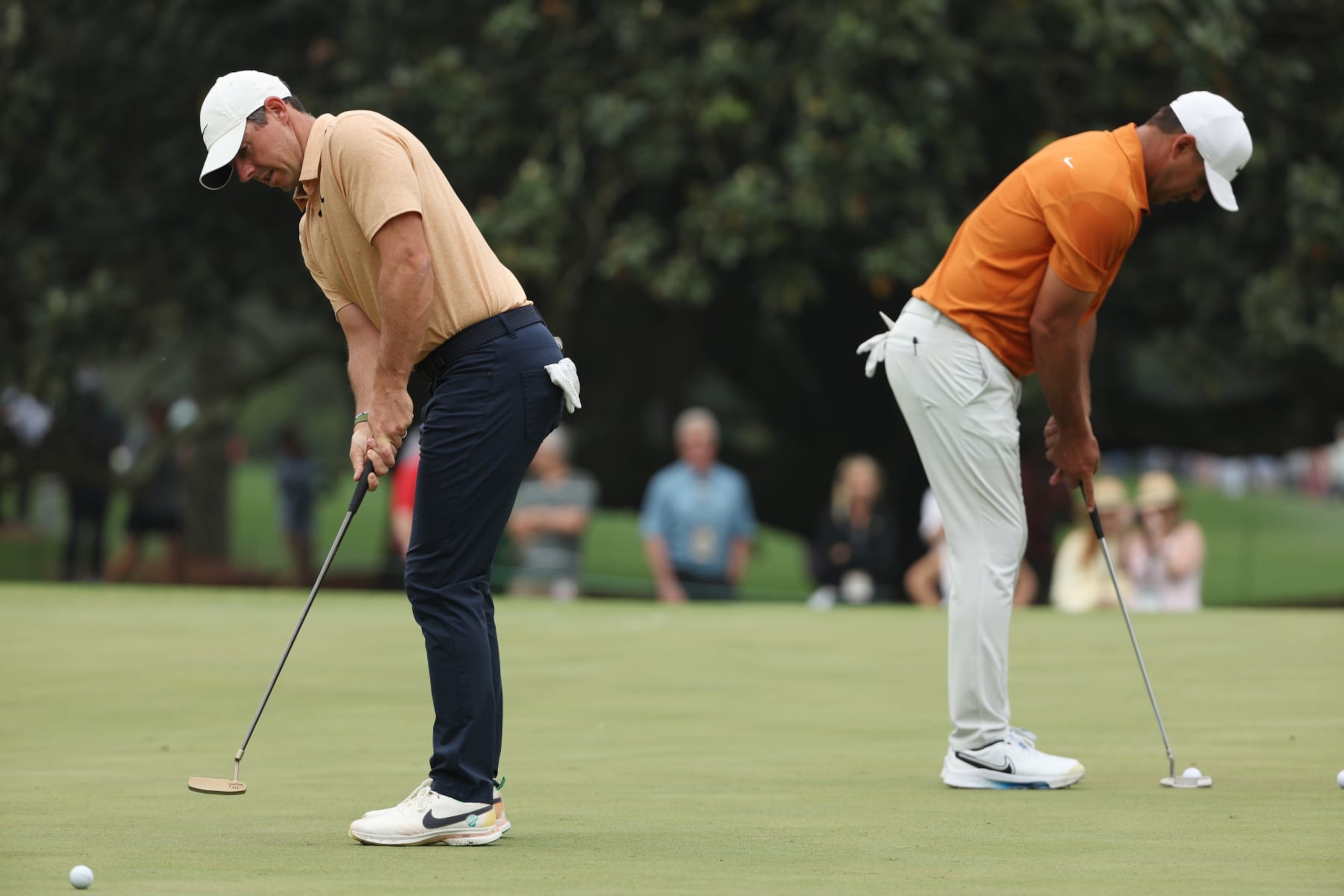 AUGUSTA, GEORGIA - APRIL 04: Rory McIlroy of Northern Ireland and Brooks Koepka of the United States putt on the first green during a practice round prior to the 2023 Masters Tournament at Augusta National Golf Club on April 04, 2023 in Augusta, Georgia. (Photo by Patrick Smith/Getty Images) AUGUSTA, GEORGIA - APRIL 04: Rory McIlroy of Northern Ireland and Brooks Koepka of the United States putt on the first green during a practice round prior to the 2023 Masters Tournament at Augusta National Golf Club on April 04, 2023 in Augusta, Georgia. (Photo by Patrick Smith/Getty Images)