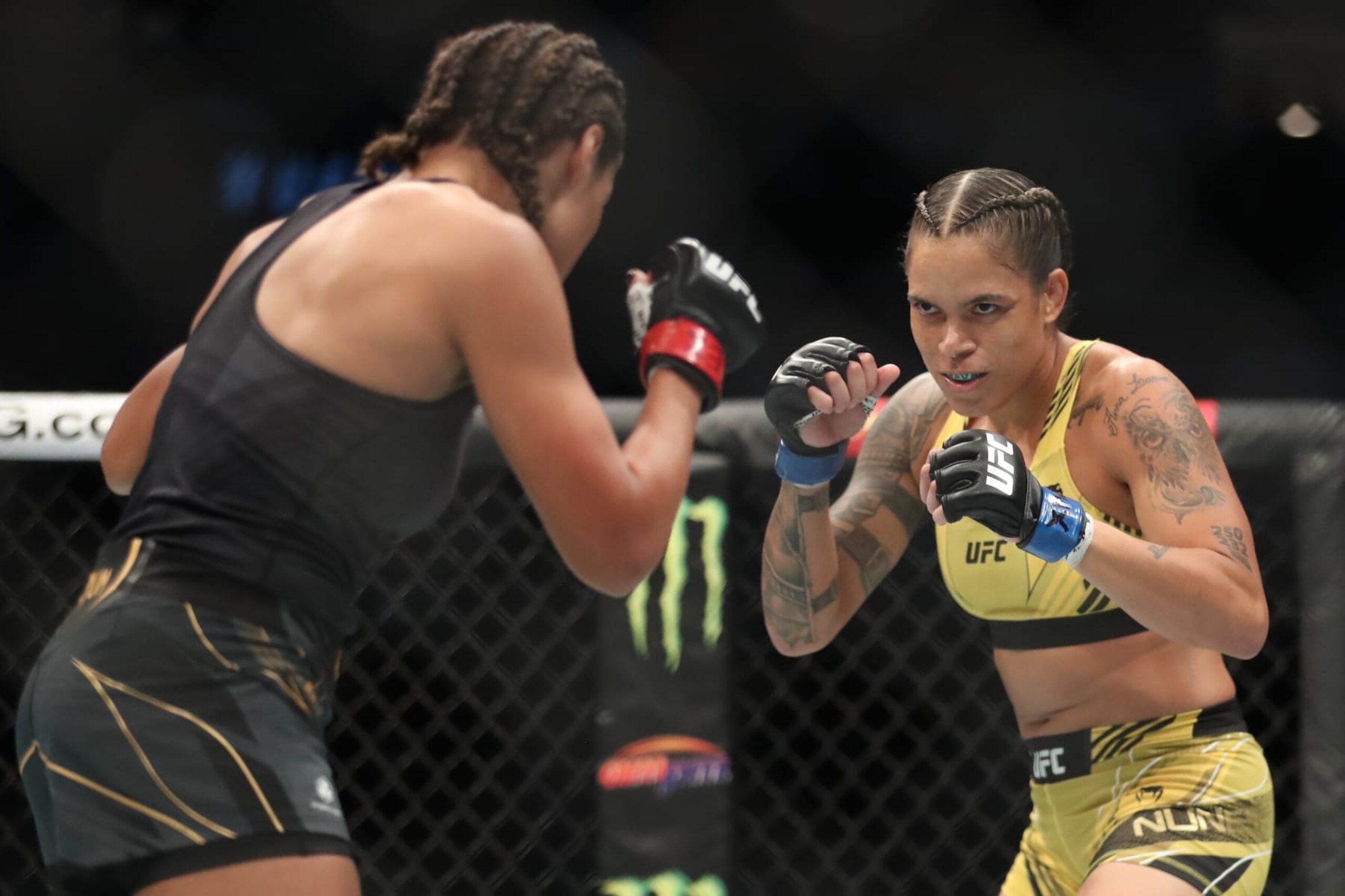DALLAS, TX - JULY 30: (R-L) Amanda Nunes battles Julianna Peña in their Women Bantamweight bout during the UFC 277 event at American Airlines Center on July 30, 2022, in Dallas, Texas, United States. (Photo by Alejandro Salazar/PxImages/Icon Sportswire via Getty Images)