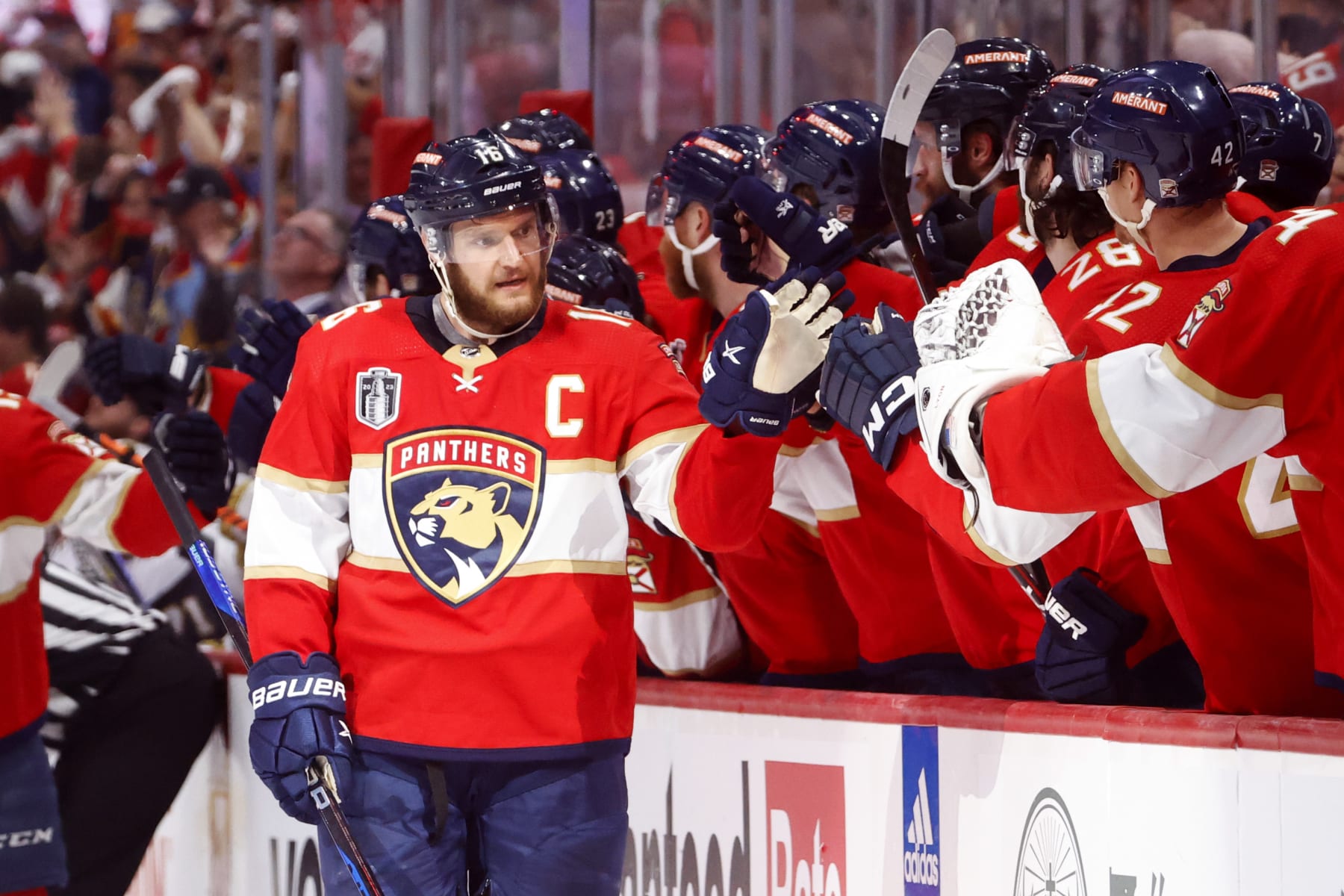 SUNRISE, FLORIDA - JUNE 10:  Aleksander Barkov #16 of the Florida Panthers is congratulated by his teammates at the bench after scoring a goal against the Vegas Golden Knights during the third period in Game Four of the 2023 NHL Stanley Cup Final at FLA Live Arena on June 10, 2023 in Sunrise, Florida. (Photo by Joel Auerbach/Getty Images)
