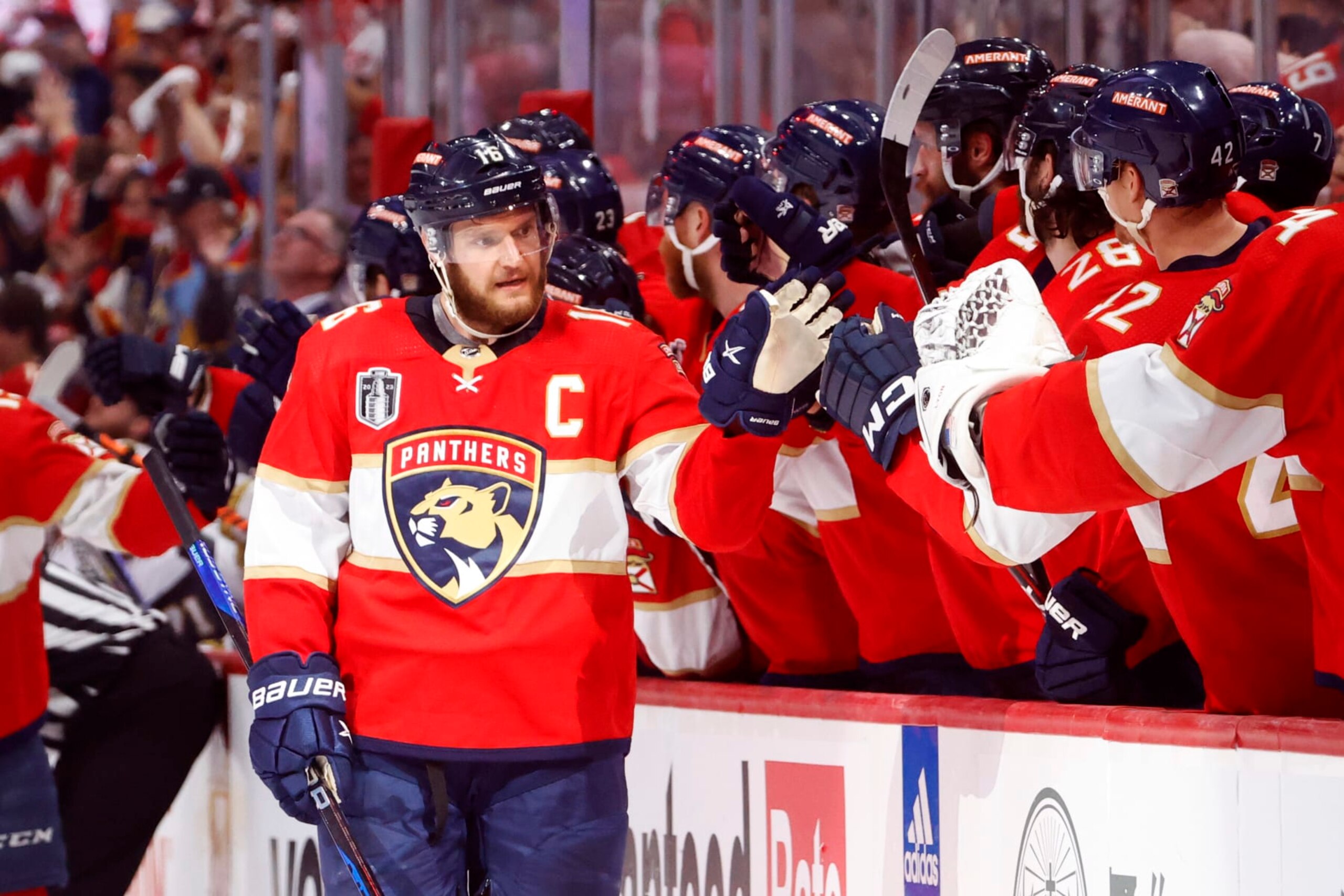 SUNRISE, FLORIDA - JUNE 10:  Aleksander Barkov #16 of the Florida Panthers is congratulated by his teammates at the bench after scoring a goal against the Vegas Golden Knights during the third period in Game Four of the 2023 NHL Stanley Cup Final at FLA Live Arena on June 10, 2023 in Sunrise, Florida. (Photo by Joel Auerbach/Getty Images)