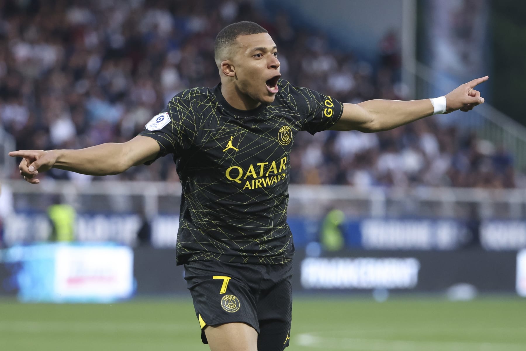 AUXERRE, FRANCE - MAY 21: Kylian Mbappe of PSG celebrates his second goal during the Ligue 1 Uber Eats match between AJ Auxerre (AJA) and Paris Saint-Germain (PSG) at Stade de l'Abbe Deschamps on May 21, 2023 in Auxerre, France. (Photo by Jean Catuffe/Getty Images)