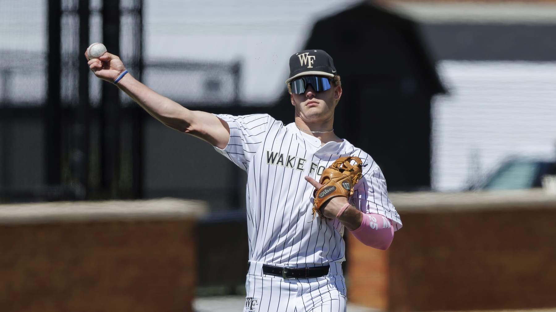 Wake Forest's Brock Wilken (25) makes a throw during an NCAA baseball game on Sunday, April 9, 2023, in Winston-Salem, N.C. (AP Photo/Ben McKeown)