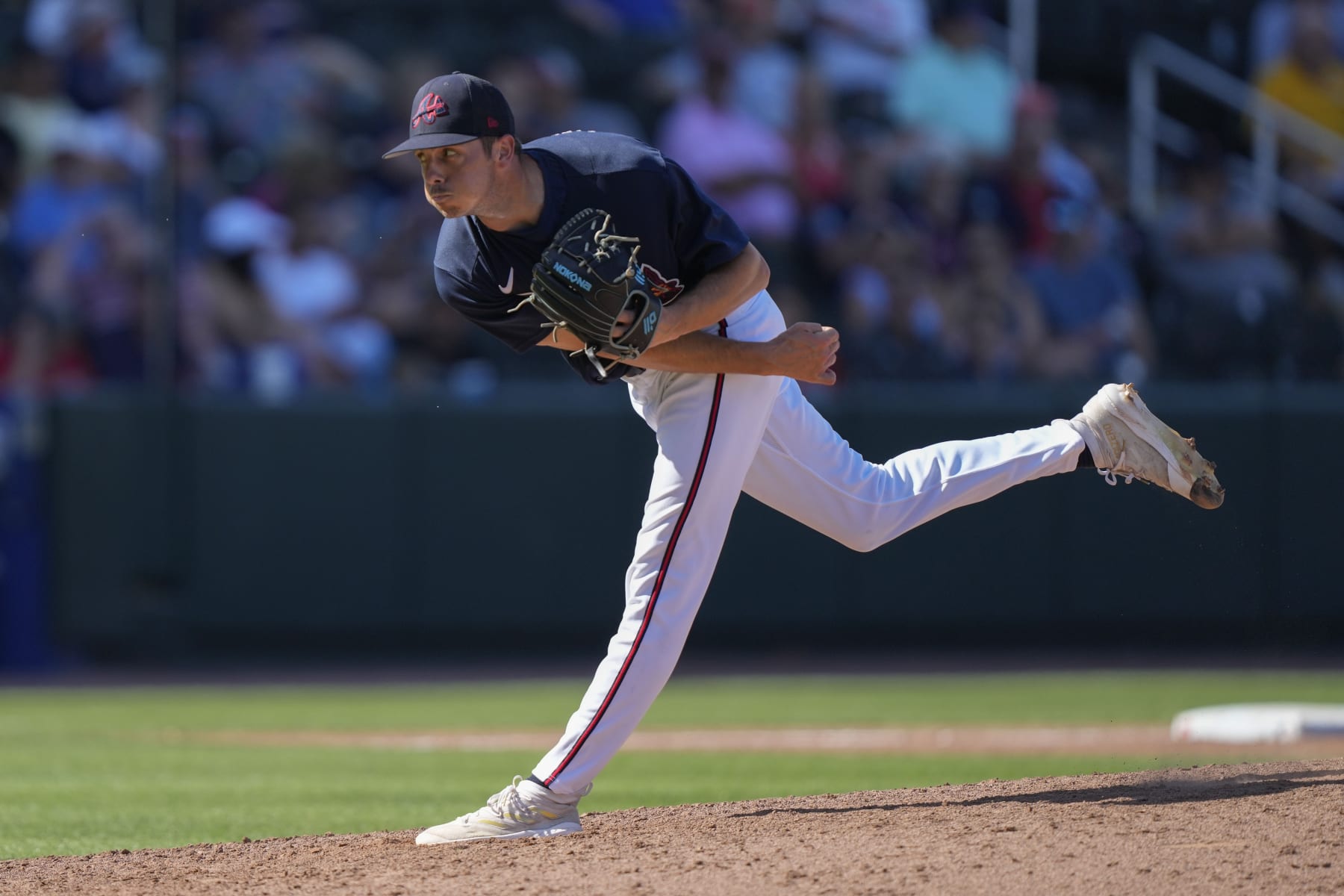 Atlanta Braves pitcher Allan Winans throws in the eighth inning of a spring training baseball game against the Minnesota Twins in North Port, Fla., Saturday, March 4, 2023. (AP Photo/Gerald Herbert)
