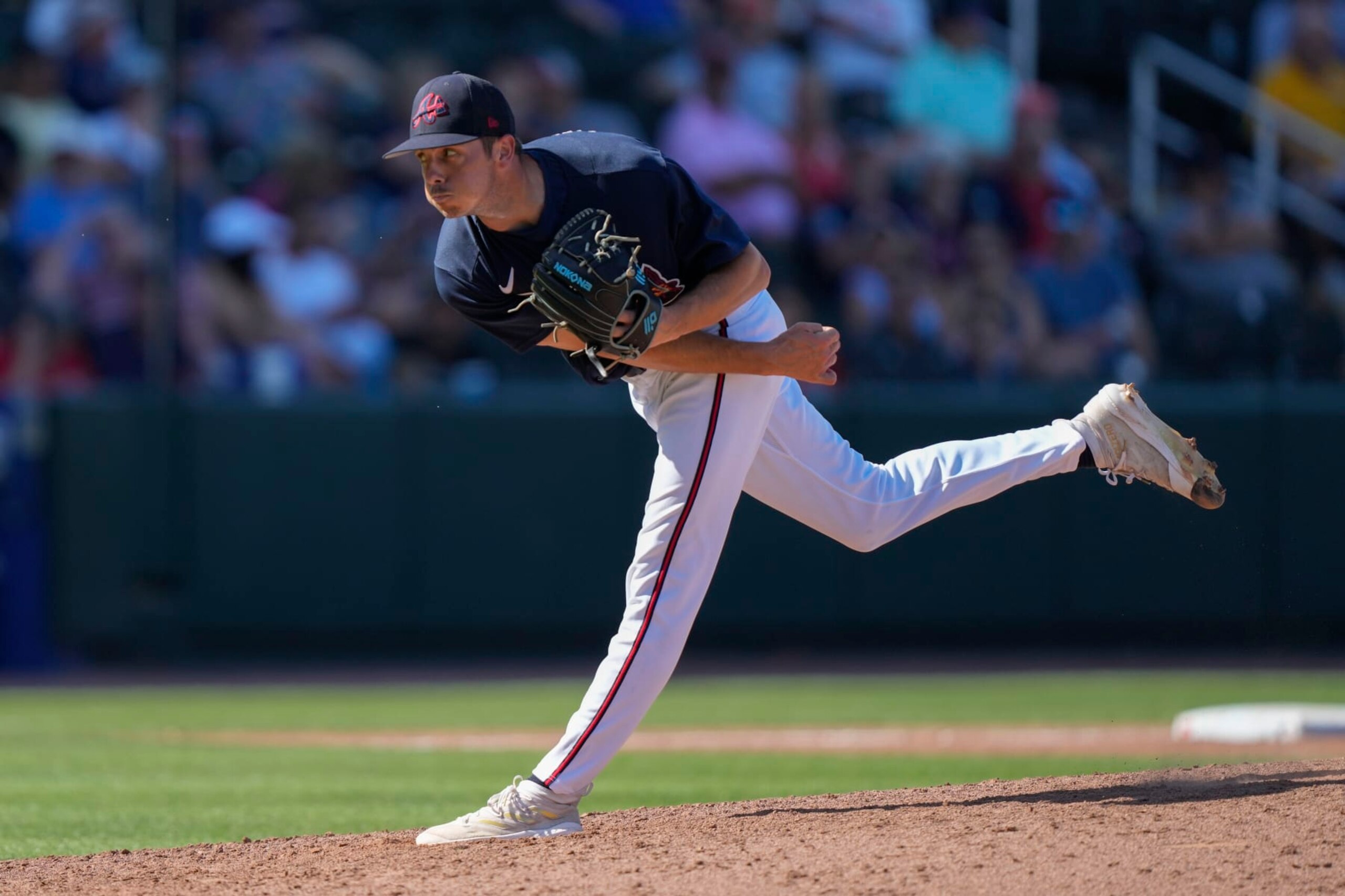 Atlanta Braves pitcher Allan Winans throws in the eighth inning of a spring training baseball game against the Minnesota Twins in North Port, Fla., Saturday, March 4, 2023. (AP Photo/Gerald Herbert)