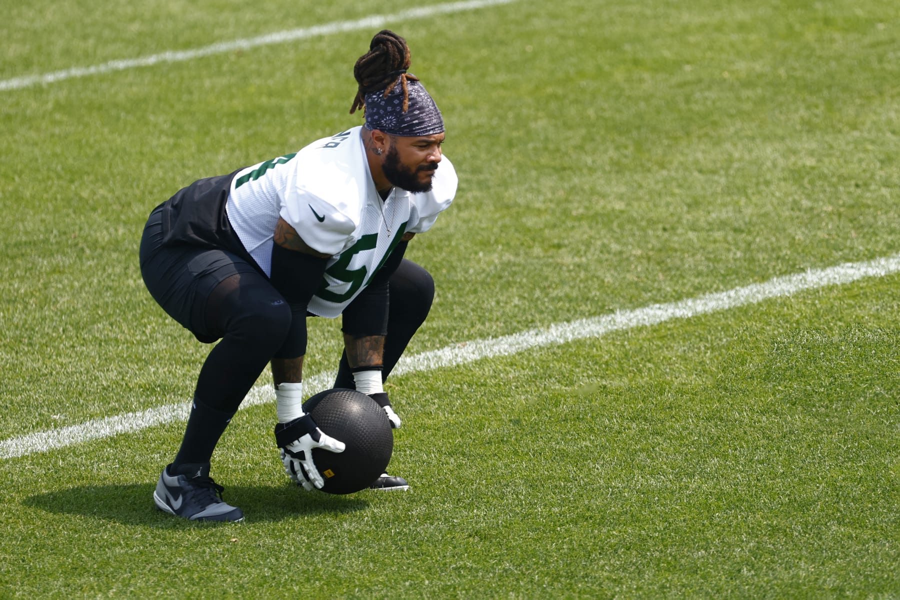FLORHAM PARK, NEW JERSEY - JUNE 6: Billy Turner #54 of the New York Jets throws a medicine ball during the teams OTAs at Atlantic Health Jets Training Center on June 6, 2023 in Florham Park, New Jersey. (Photo by Rich Schultz/Getty Images)