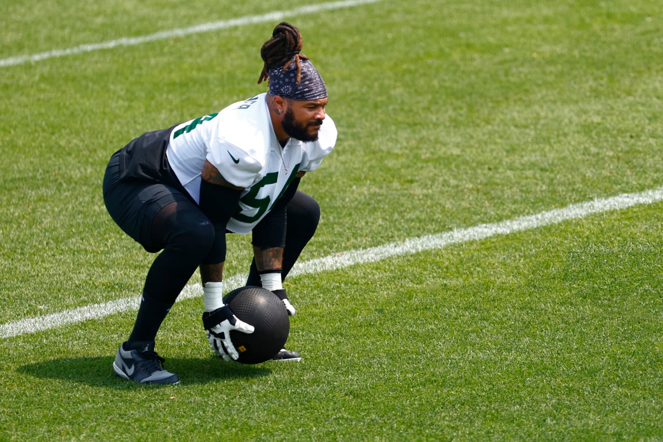 FLORHAM PARK, NEW JERSEY - JUNE 6: Billy Turner #54 of the New York Jets throws a medicine ball during the teams OTAs at Atlantic Health Jets Training Center on June 6, 2023 in Florham Park, New Jersey. (Photo by Rich Schultz/Getty Images)