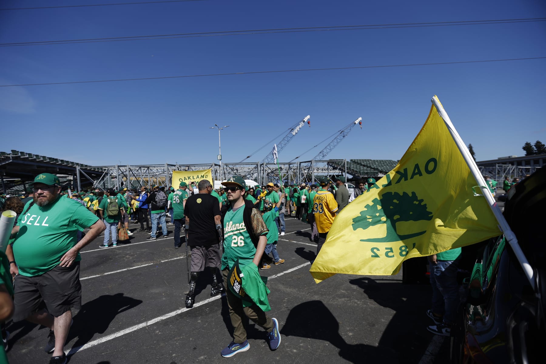 Fans stand outside Oakland Coliseum to protest the Oakland Athletics' planned move to Las Vegas, before a baseball game between the Athletics and the Tampa Bay Rays in Oakland, Calif., Tuesday, June 13, 2023. (AP Photo/Jed Jacobsohn)