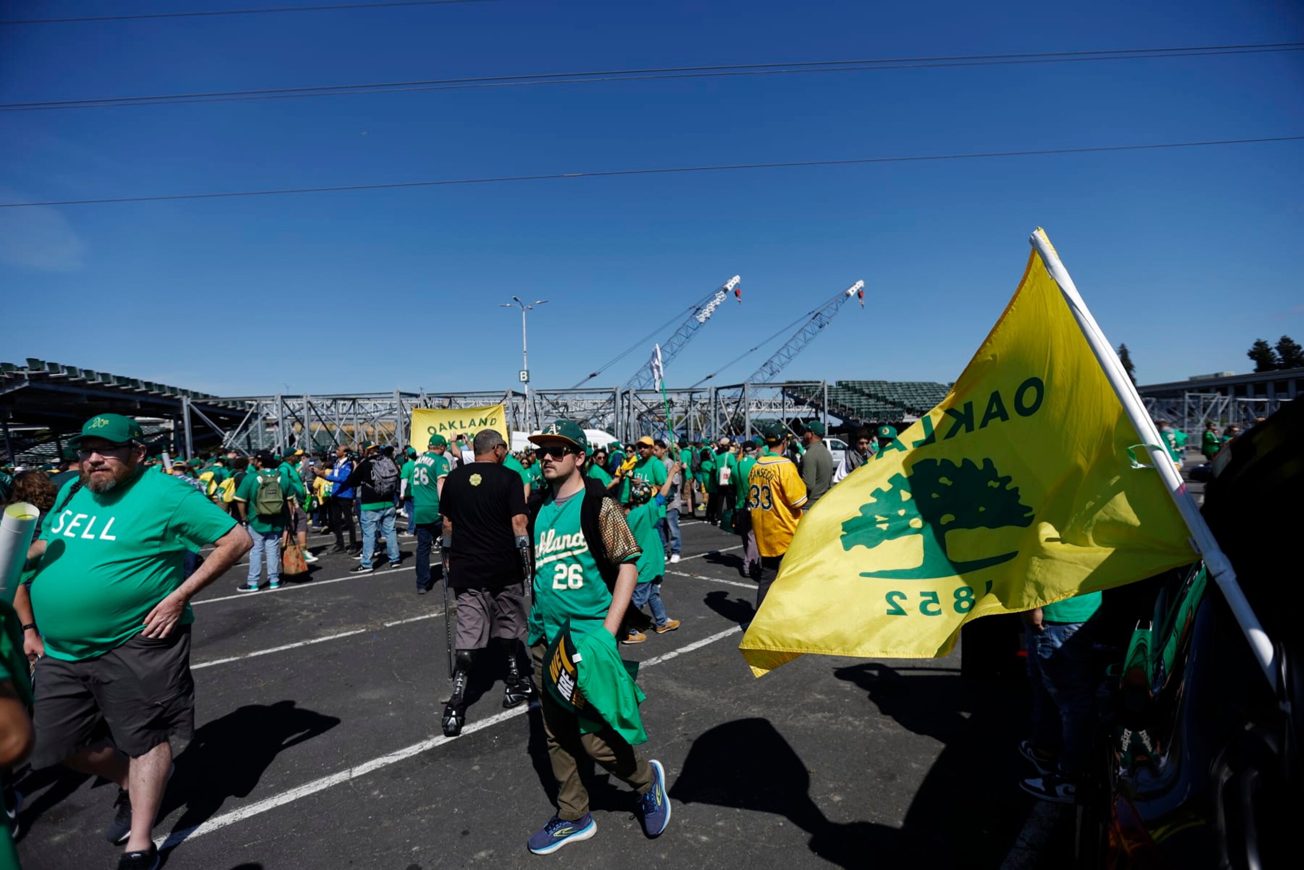 Fans stand outside Oakland Coliseum to protest the Oakland Athletics' planned move to Las Vegas, before a baseball game between the Athletics and the Tampa Bay Rays in Oakland, Calif., Tuesday, June 13, 2023. (AP Photo/Jed Jacobsohn)