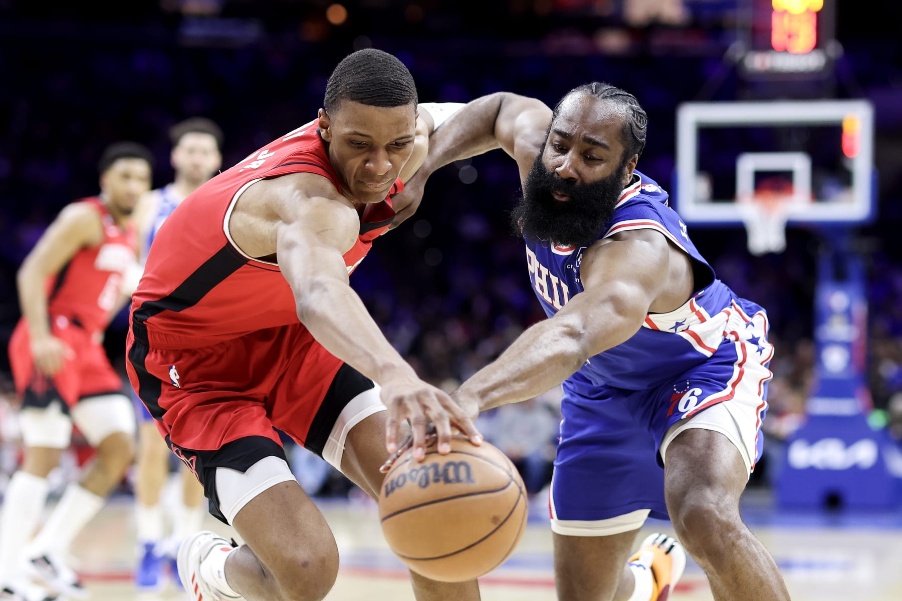 PHILADELPHIA, PENNSYLVANIA - FEBRUARY 13: Jabari Smith Jr. #1 of the Houston Rockets and James Harden #1 of the Philadelphia 76ers reach for a loose ball during the second quarter at Wells Fargo Center on February 13, 2023 in Philadelphia, Pennsylvania. NOTE TO USER: User expressly acknowledges and agrees that, by downloading and or using this photograph, User is consenting to the terms and conditions of the Getty Images License Agreement. (Photo by Tim Nwachukwu/Getty Images)