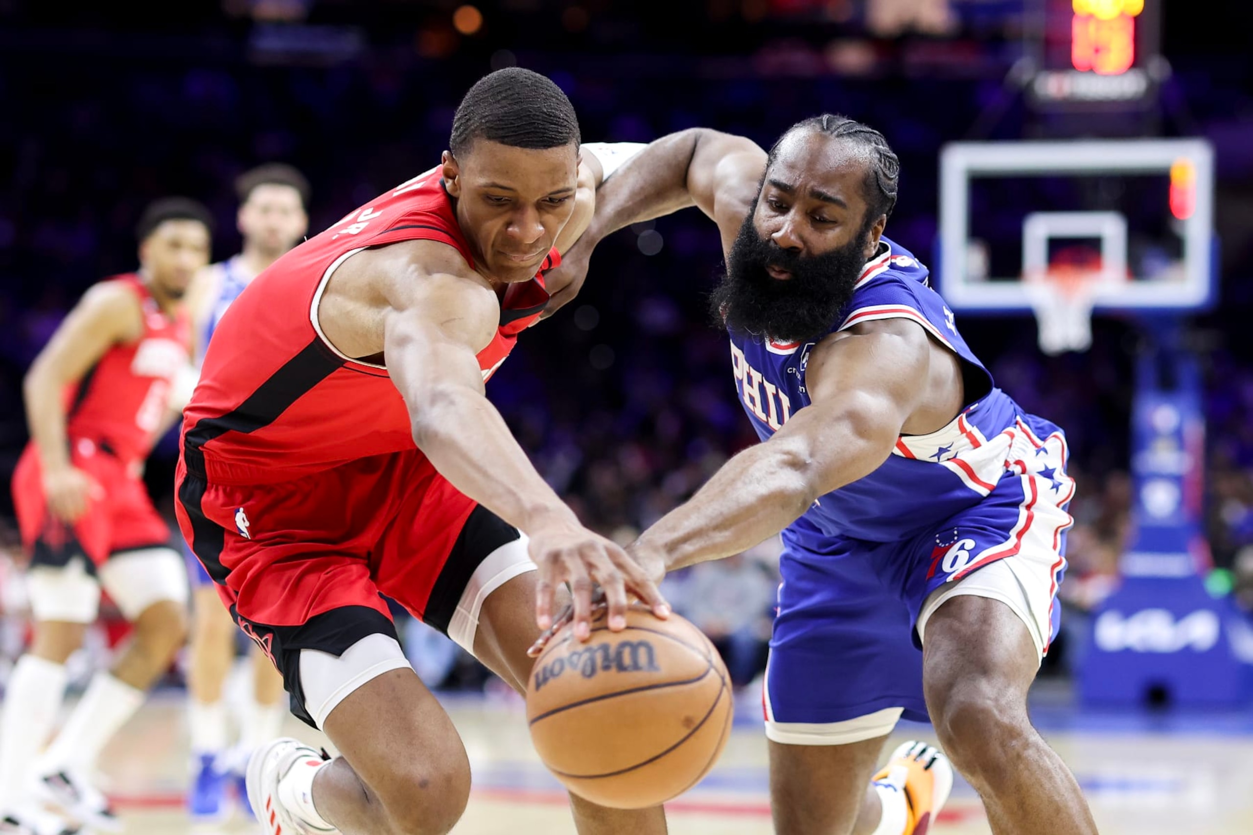 PHILADELPHIA, PENNSYLVANIA - FEBRUARY 13: Jabari Smith Jr. #1 of the Houston Rockets and James Harden #1 of the Philadelphia 76ers reach for a loose ball during the second quarter at Wells Fargo Center on February 13, 2023 in Philadelphia, Pennsylvania. NOTE TO USER: User expressly acknowledges and agrees that, by downloading and or using this photograph, User is consenting to the terms and conditions of the Getty Images License Agreement. (Photo by Tim Nwachukwu/Getty Images)
