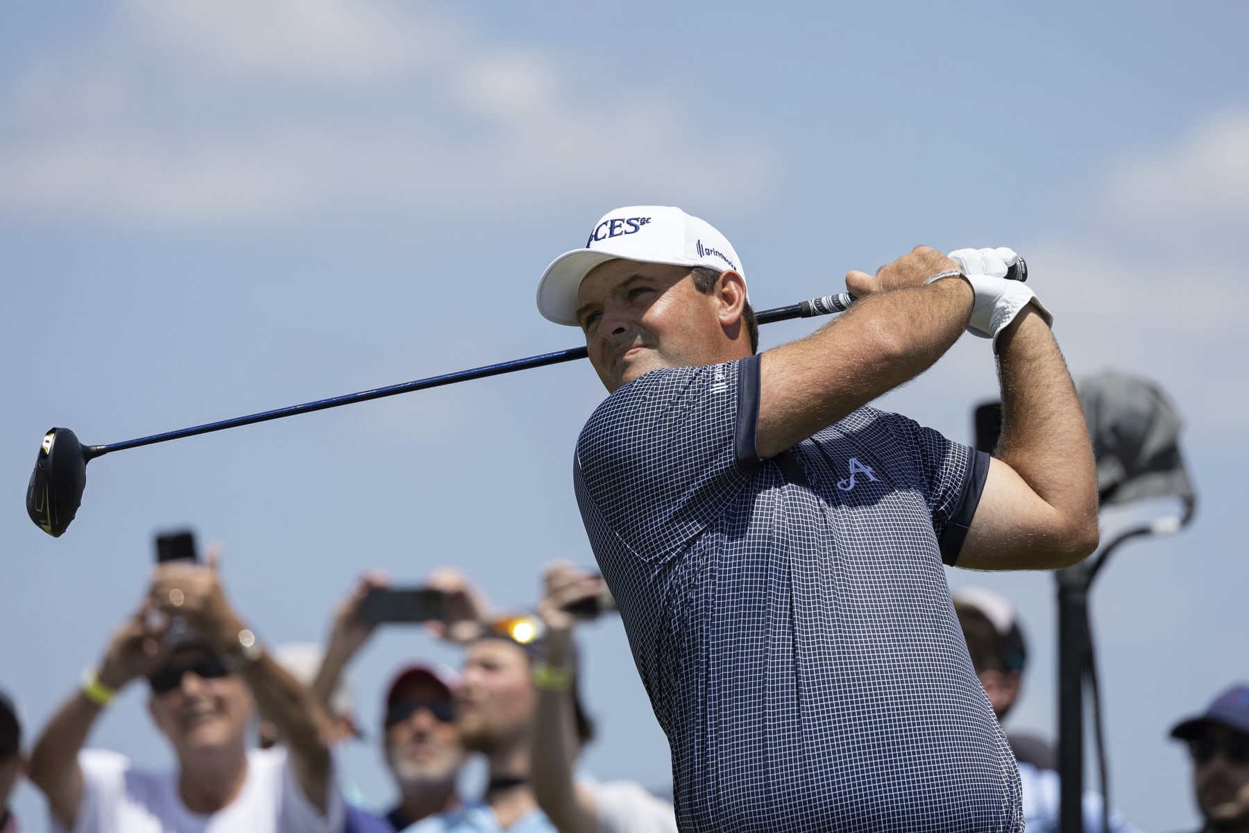 Patrick Reed of 4Aces GC hits his shot from the fifth tee during the first round of LIV Golf DC at the Trump National Golf Club Washington DC on Friday, May 26, 2023 in Sterling, Virginia. (Photo by Hunter Martin/LIV Golf via AP)