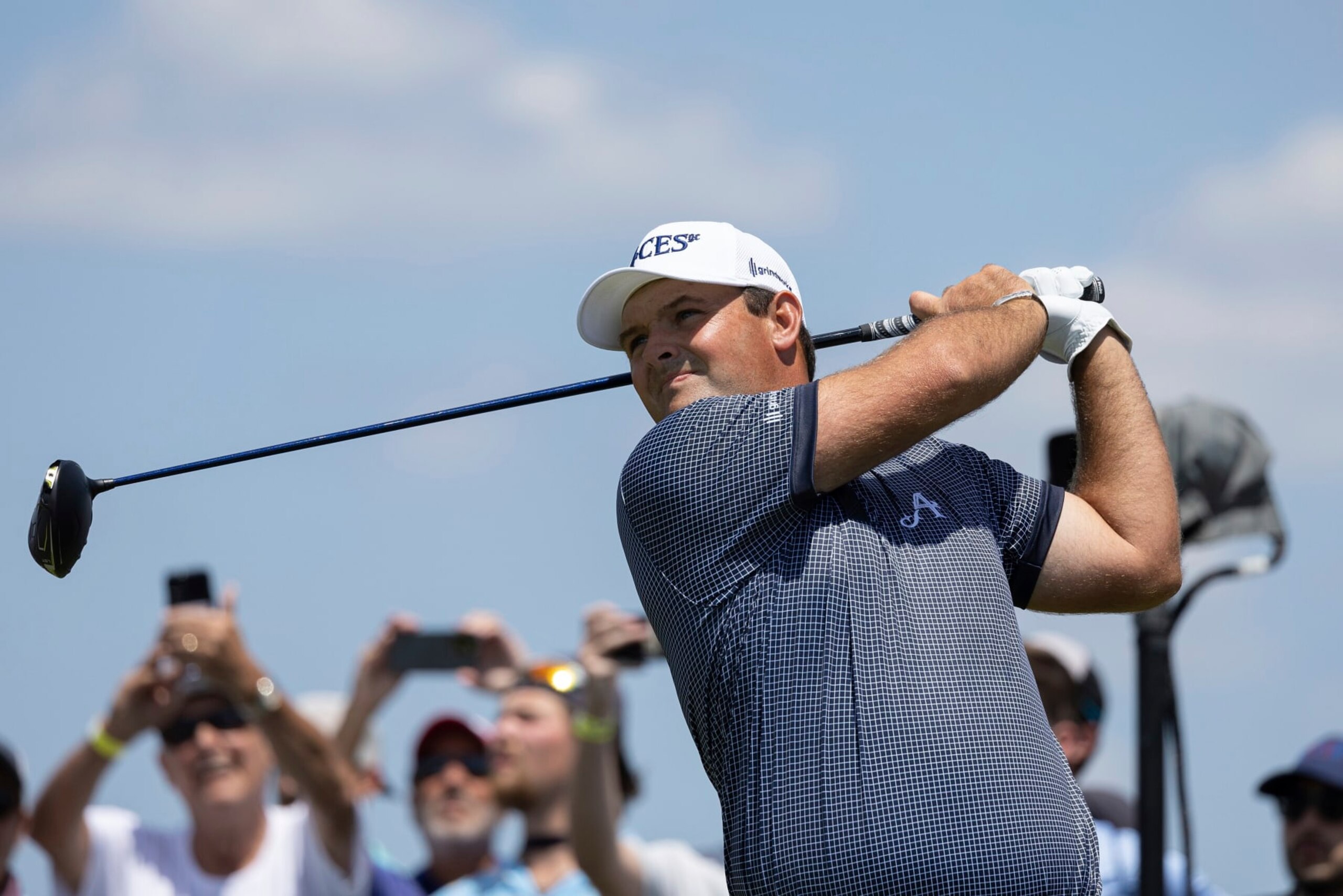 Patrick Reed of 4Aces GC hits his shot from the fifth tee during the first round of LIV Golf DC at the Trump National Golf Club Washington DC on Friday, May 26, 2023 in Sterling, Virginia. (Photo by Hunter Martin/LIV Golf via AP)