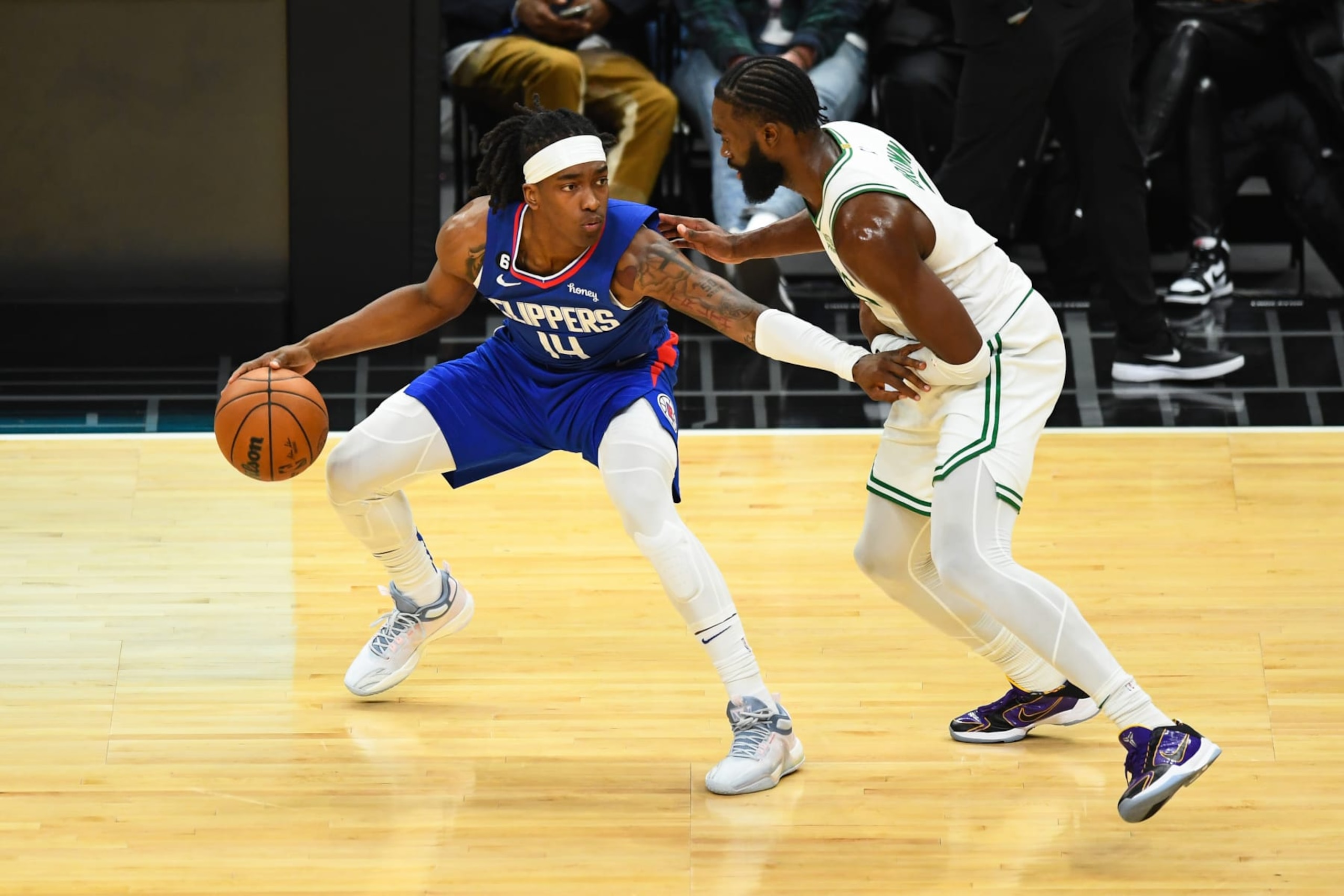 LOS ANGELES, CA - DECEMBER 12: Los Angeles Clippers Forward Terance Mann (14) guarded closely by Boston Celtics Guard Jaylen Brown (7) during a NBA game between the Boston Celtics and the Los Angeles Clippers on December 12, 2022 at Crypto.com Arena in Los Angeles, CA. (Photo by Brian Rothmuller/Icon Sportswire via Getty Images)