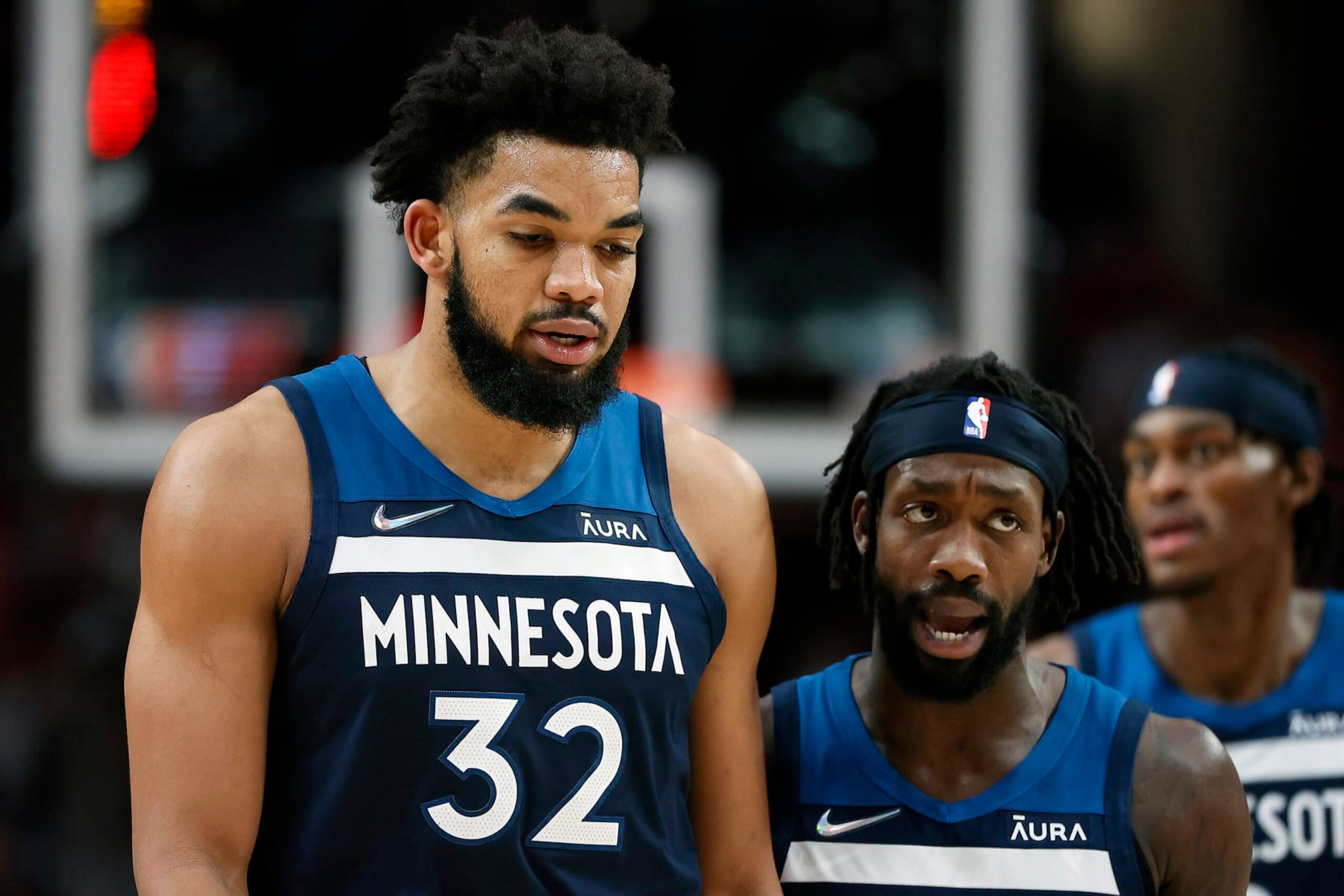 PORTLAND, OREGON - DECEMBER 12: Patrick Beverley (R) talks with Karl-Anthony Towns # 32 of the Minnesota Timberwolves during the first half against the Portland Trail Blazers at Moda Center on December 12, 2021 in Portland, Oregon. NOTE TO USER: User expressly acknowledges and agrees that, by downloading and or using this photograph, User is consenting to the terms and conditions of the Getty Images License Agreement. (Photo by Soobum Im/Getty Images)