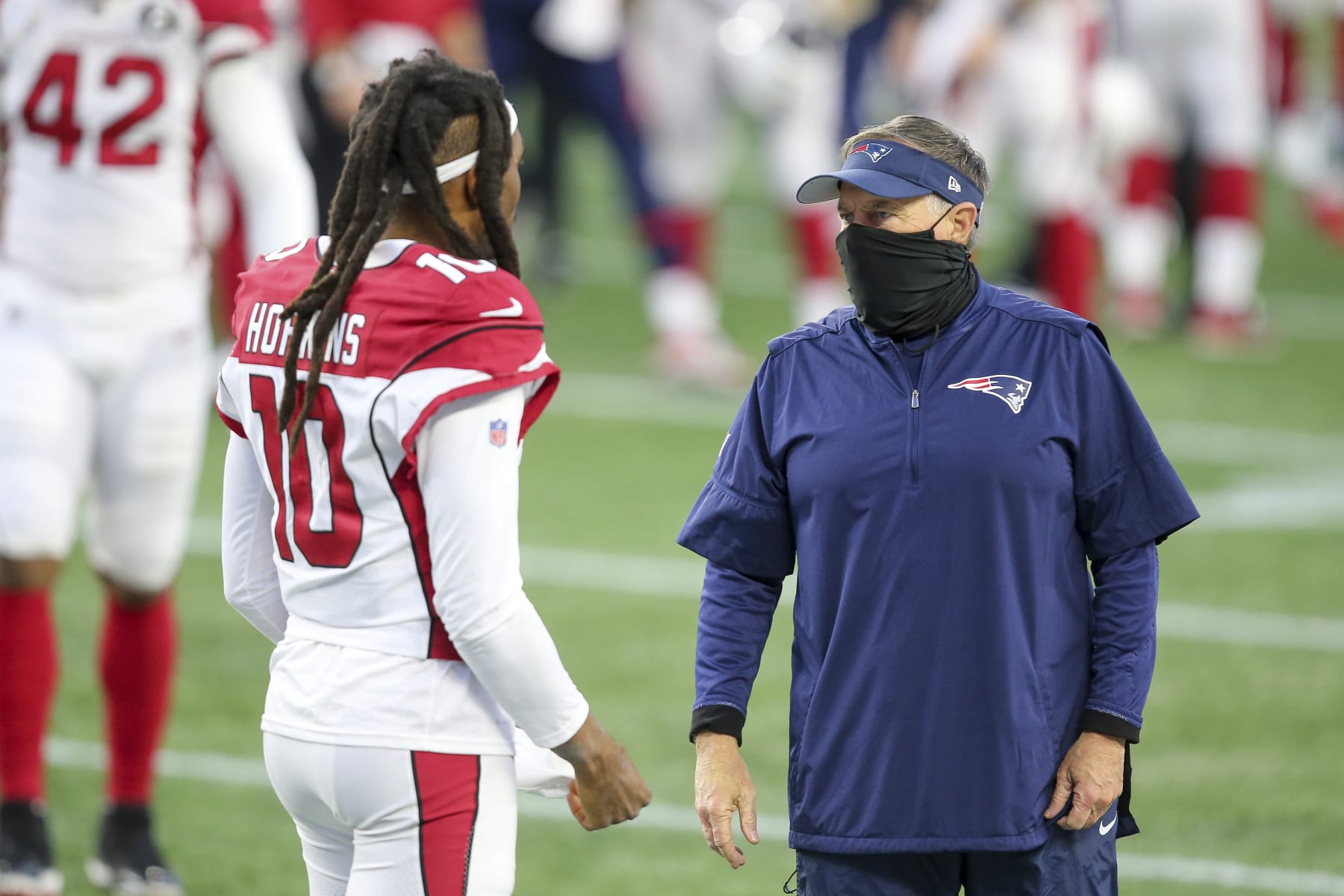 New England Patriots head coach Bill Belichick talks with Arizona Cardinals wide receiver DeAndre Hopkins (10) following an NFL football game, Sunday, Nov. 29, 2020, in Foxborough, Mass. (AP Photo/Stew Milne)