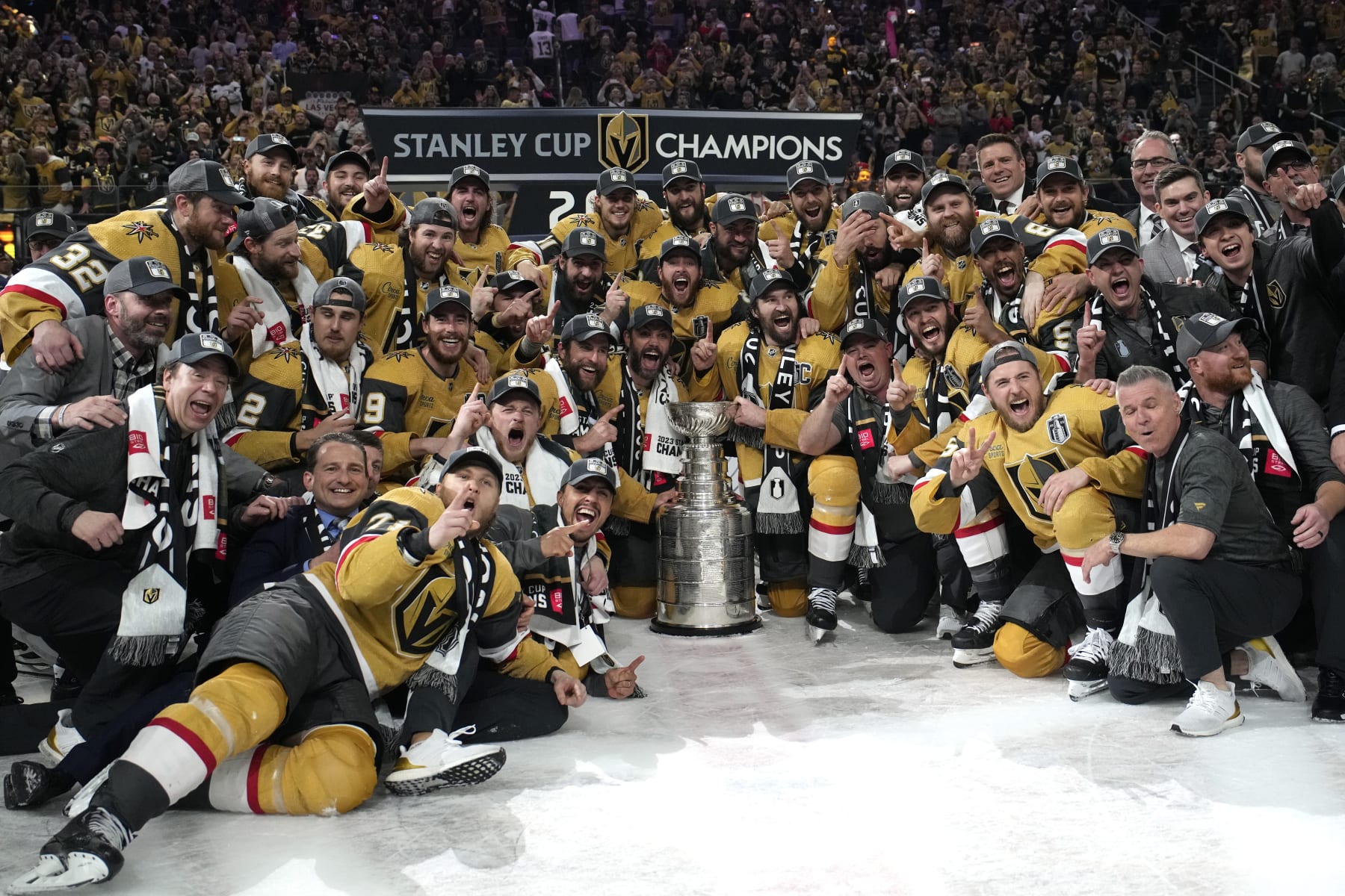 Members of the Vegas Golden Knights pose with the Stanley Cup after the Knights defeated the Florida Panthers 9-3 in Game 5 of the NHL hockey Stanley Cup Finals Tuesday, June 13, 2023, in Las Vegas. The Knights won the series 4-1. (AP Photo/John Locher)