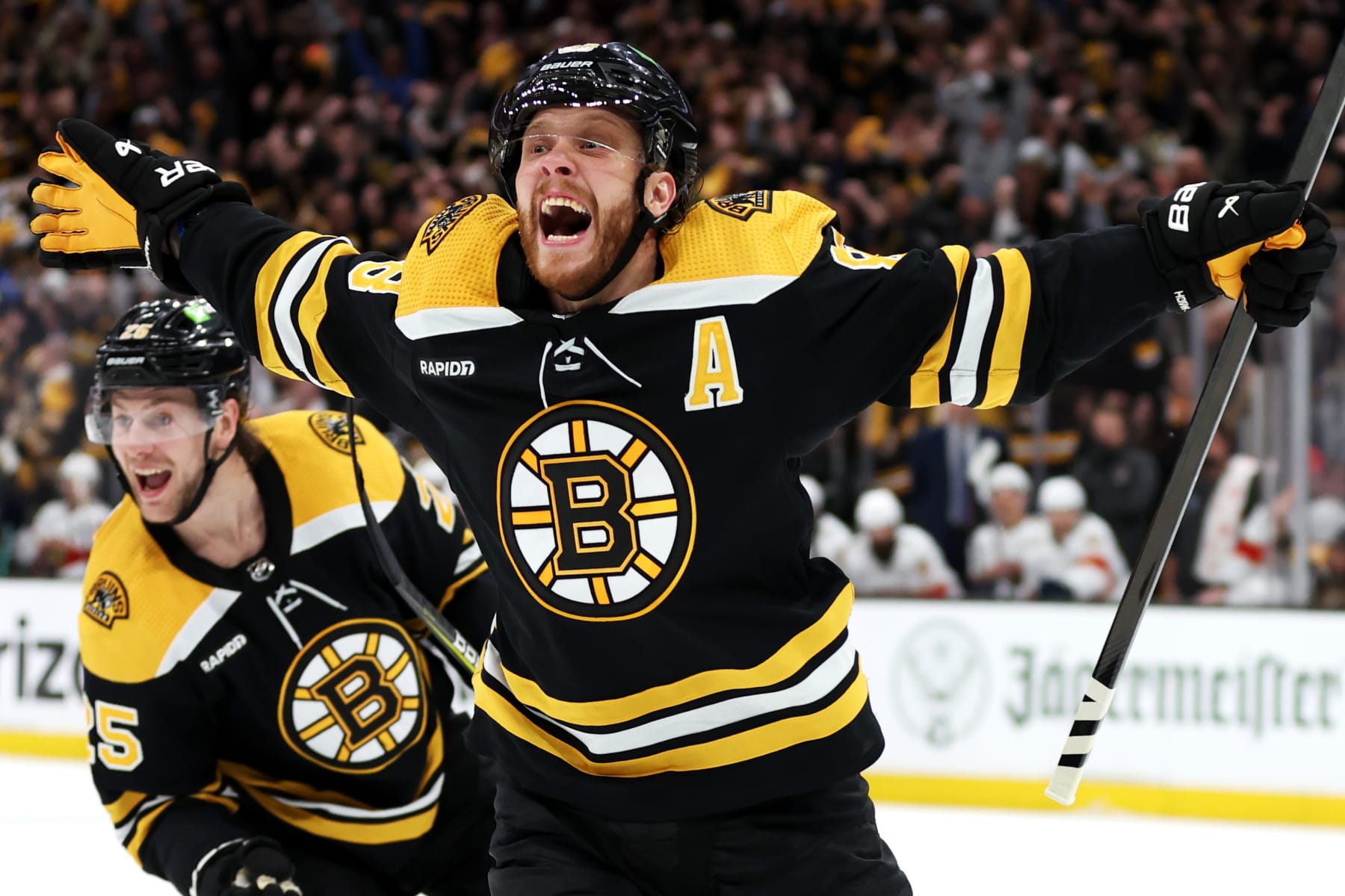 BOSTON, MASSACHUSETTS - APRIL 30: David Pastrnak #88 of the Boston Bruins celebrates with Brandon Carlo #25 after scoring a goal against the Florida Panthers during the third period in Game Seven of the First Round of the 2023 Stanley Cup Playoffs at TD Garden on April 30, 2023 in Boston, Massachusetts. (Photo by Maddie Meyer/Getty Images)