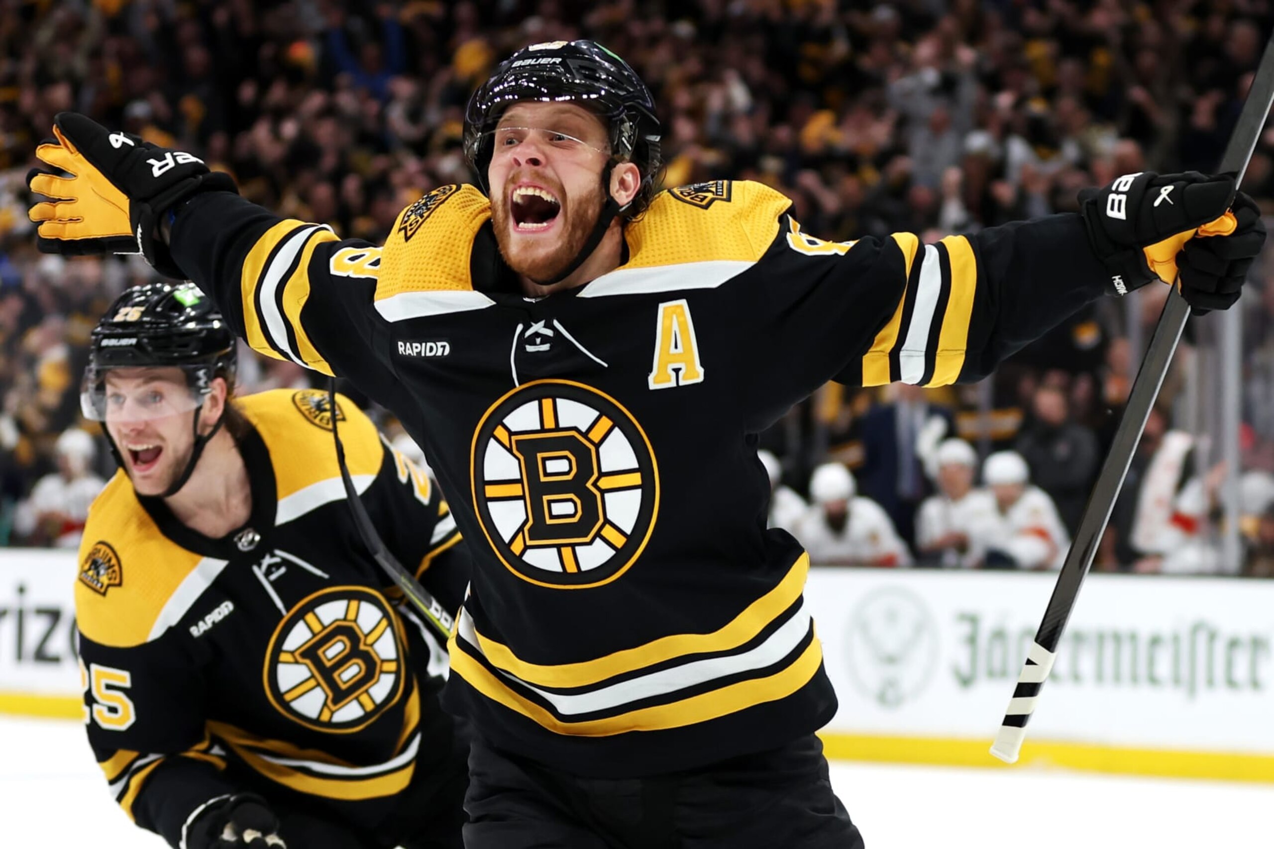 BOSTON, MASSACHUSETTS - APRIL 30: David Pastrnak #88 of the Boston Bruins celebrates with Brandon Carlo #25 after scoring a goal against the Florida Panthers during the third period in Game Seven of the First Round of the 2023 Stanley Cup Playoffs at TD Garden on April 30, 2023 in Boston, Massachusetts. (Photo by Maddie Meyer/Getty Images)