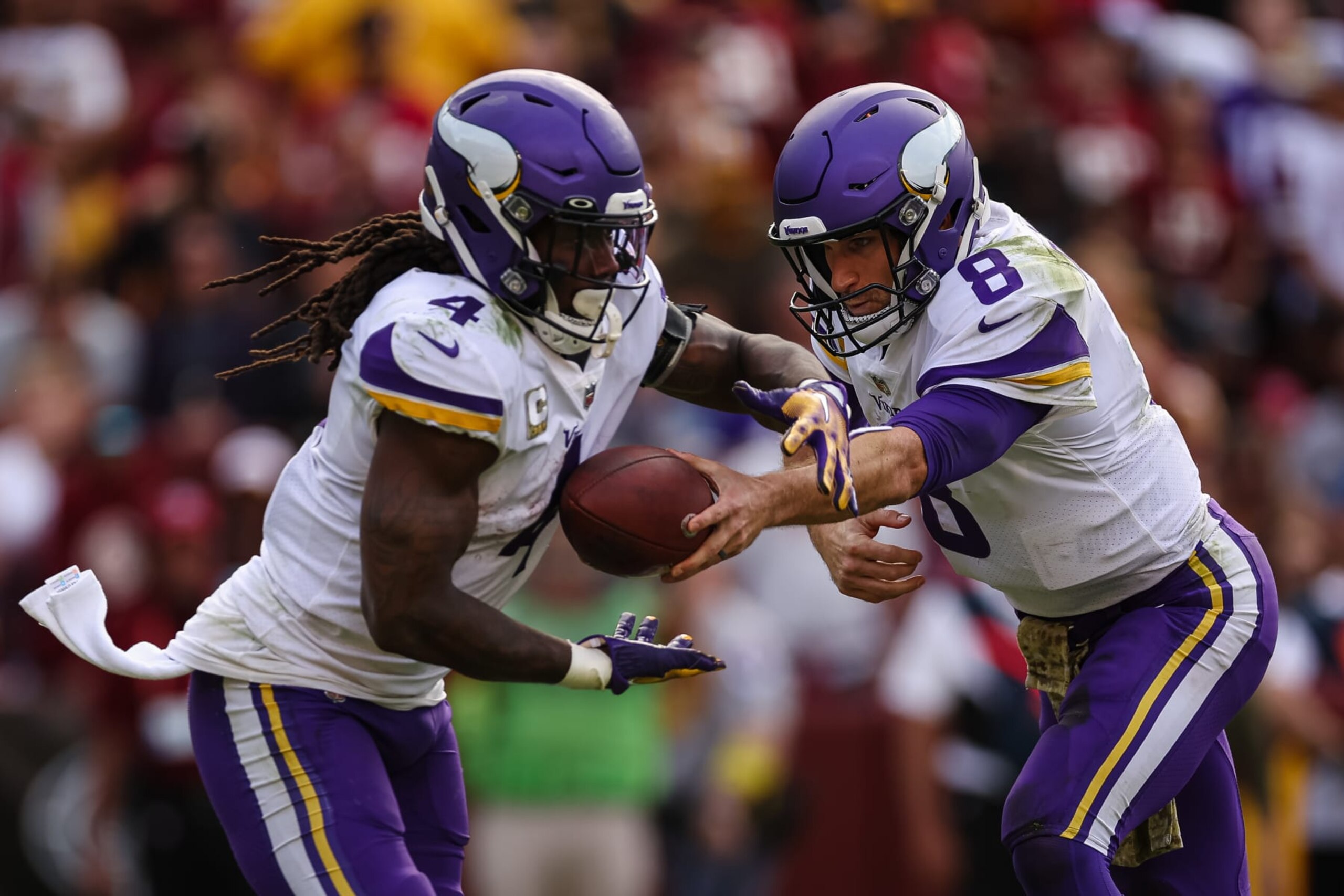 LANDOVER, MD - NOVEMBER 06: Kirk Cousins #8 of the Minnesota Vikings hands the ball off to Dalvin Cook #4 against the Washington Commanders during the second half of the game at FedExField on November 6, 2022 in Landover, Maryland. (Photo by Scott Taetsch/Getty Images) LANDOVER, MD - NOVEMBER 06: Kirk Cousins #8 of the Minnesota Vikings hands the ball off to Dalvin Cook #4 against the Washington Commanders during the second half of the game at FedExField on November 6, 2022 in Landover, Maryland. (Photo by Scott Taetsch/Getty Images)