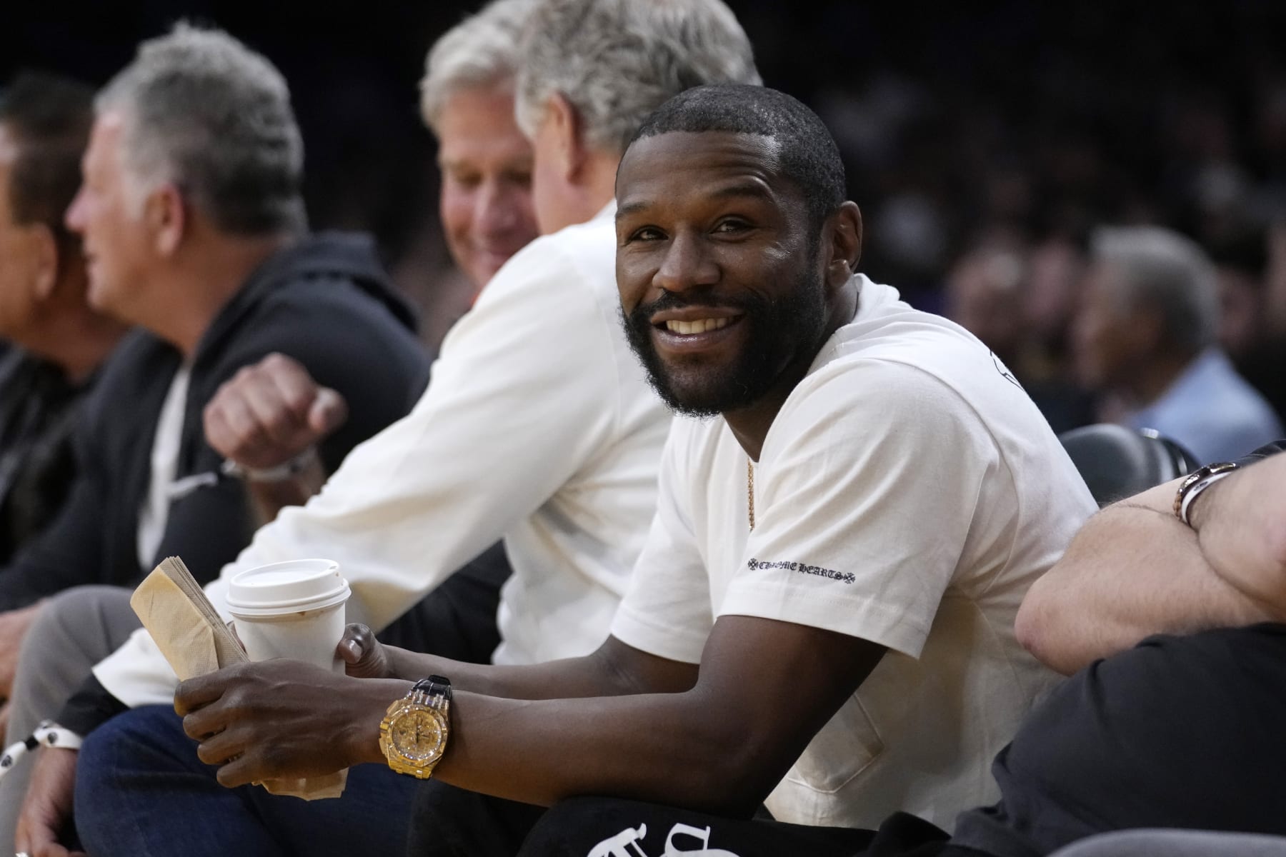 Boxer Floyd Mayweather Jr. watches during the first half in Game 4 of an NBA basketball Western Conference semifinal between the Los Angeles Lakers and the Golden State Warriors Monday, May 8, 2023, in Los Angeles. (AP Photo/Marcio Jose Sanchez)