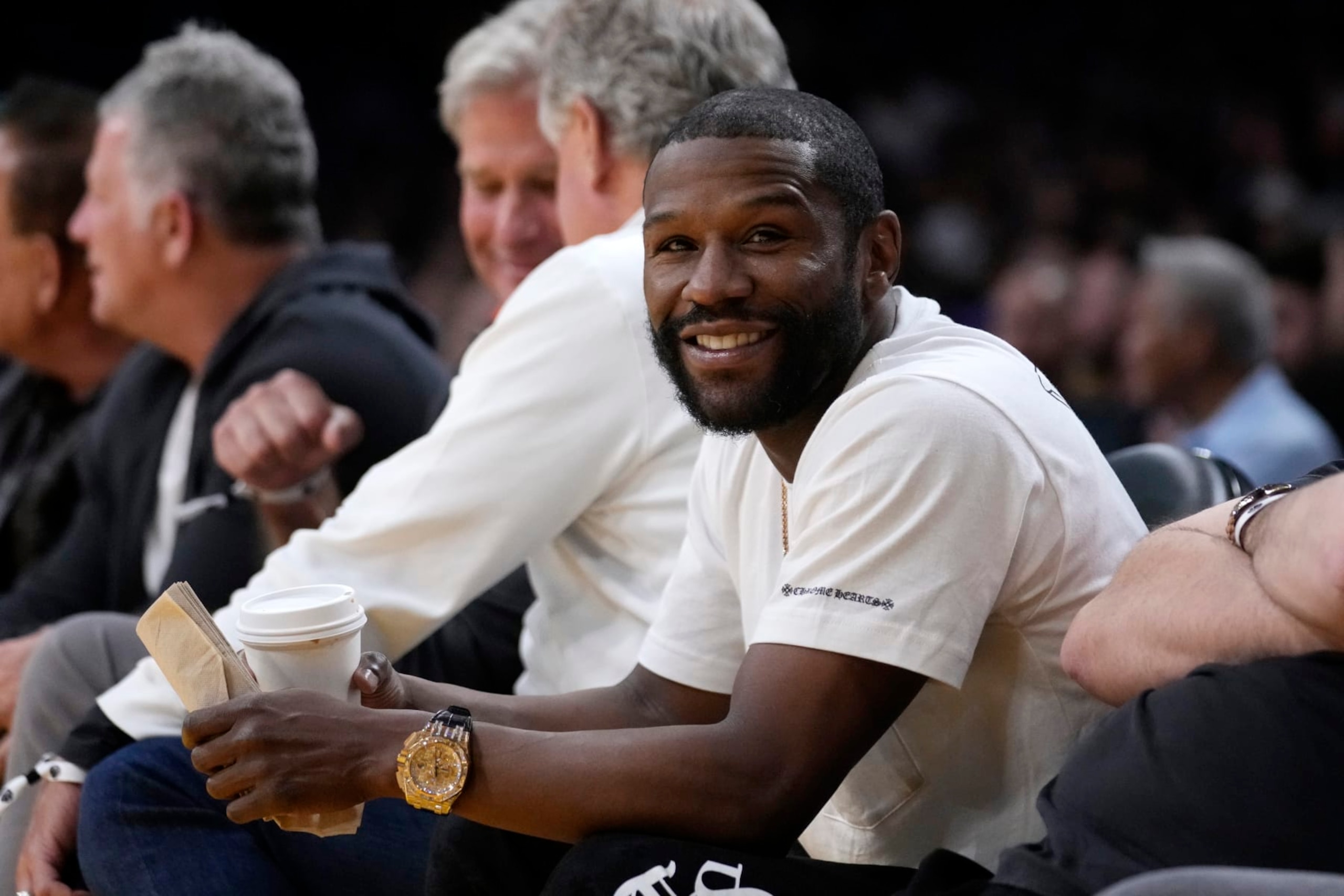Boxer Floyd Mayweather Jr. watches during the first half in Game 4 of an NBA basketball Western Conference semifinal between the Los Angeles Lakers and the Golden State Warriors Monday, May 8, 2023, in Los Angeles. (AP Photo/Marcio Jose Sanchez)