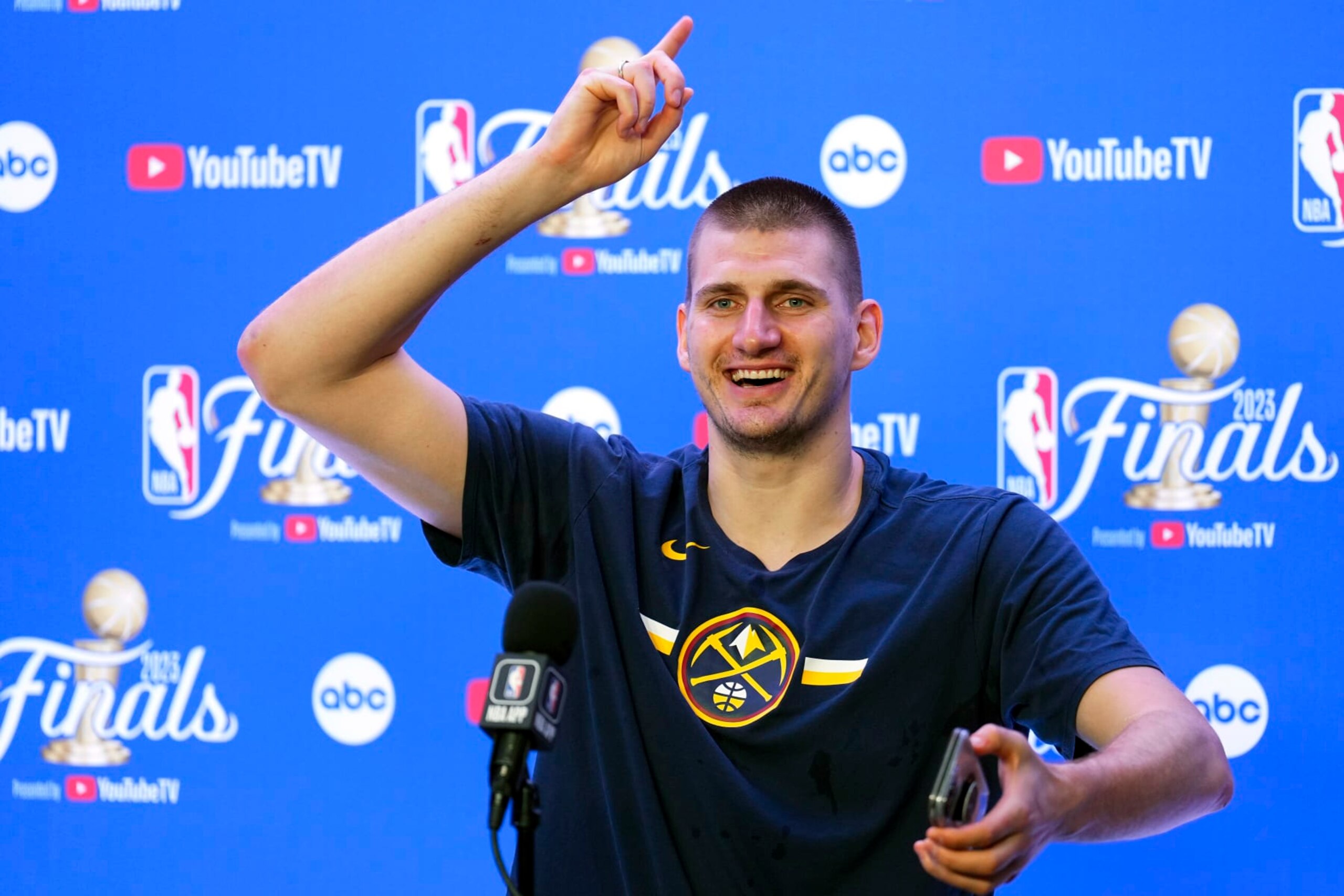 Denver Nuggets' Nikola Jokic talks to reporters after the team won the NBA Championship with a victory over the Miami Heat in Game 5 of basketball's NBA Finals, Monday, June 12, 2023, in Denver. (AP Photo/Jack Dempsey)