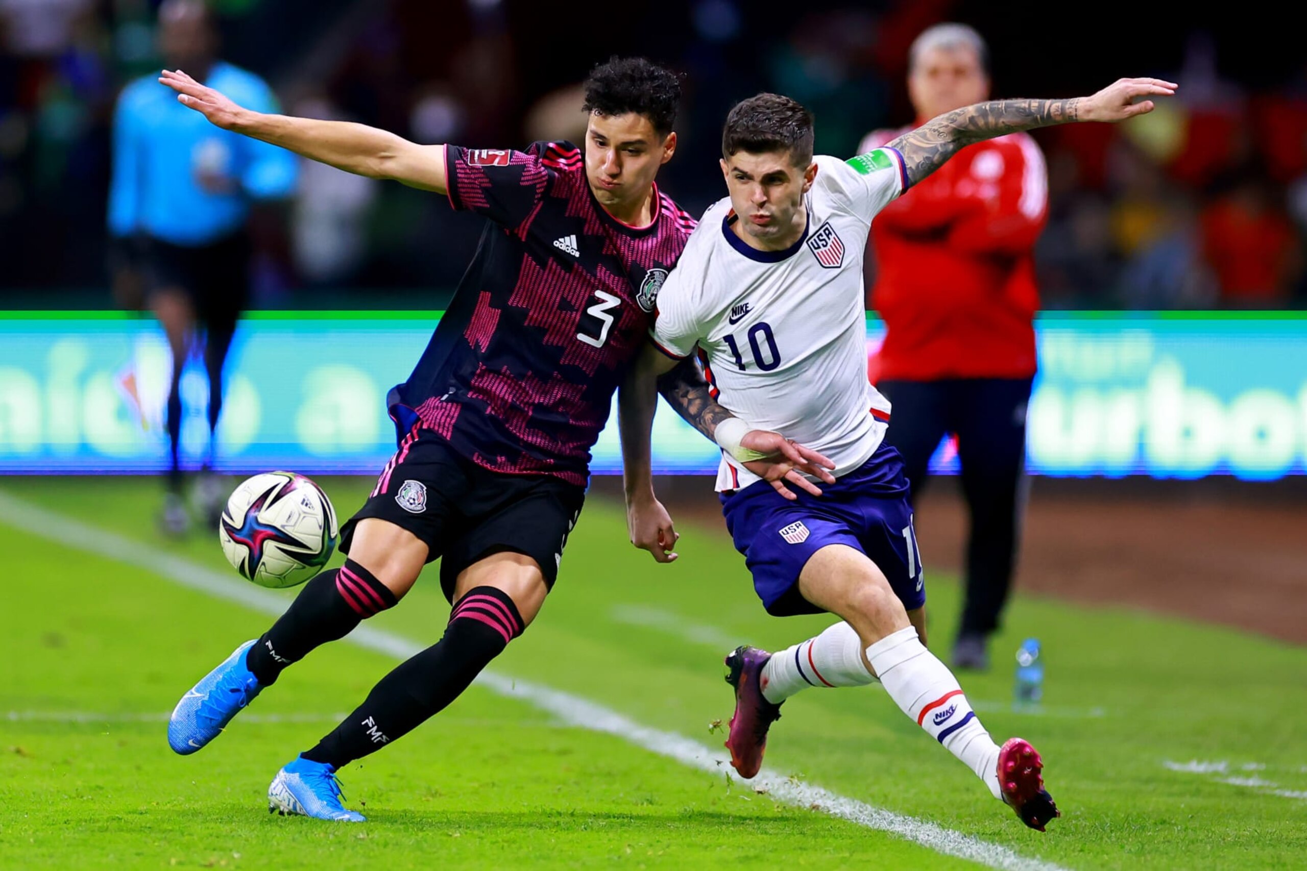MEXICO CITY, MEXICO - MARCH 24: Jorge Sánchez of Mexico fights for the ball with Christian Pulisic of United States during a match between Mexico and United States as part of Concacaf 2022 FIFA World Cup Qualifiers at Azteca Stadium on March 24, 2022 in Mexico City, Mexico. (Photo by Hector Vivas/Getty Images)