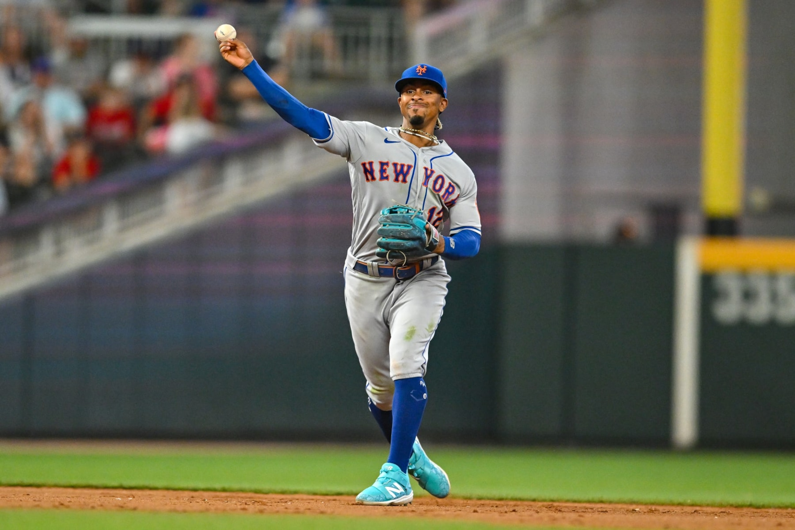 ATLANTA, GA  JUNE 07:  New York shortstop Francisco Lindor (12) throws to first base during the MLB game between the New York Mets and the Atlanta Braves on June 7th, 2023 at Truist Park in Atlanta, GA. (Photo by Rich von Biberstein/Icon Sportswire via Getty Images)