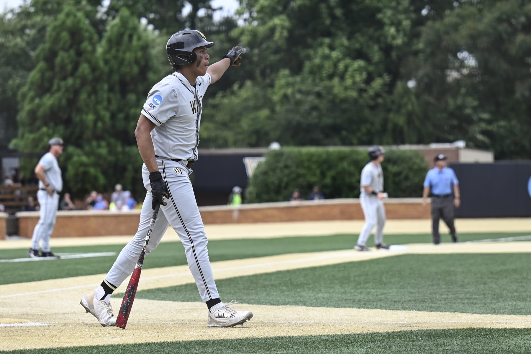 Wake Forest's Danny Corona celebrates after hitting a home run during the ninth inning of an NCAA college baseball tournament super regional game against Alabama, Sunday, June 11, 2023, in Winston-Salem, N.C. (AP Photo/Matt Kelley)