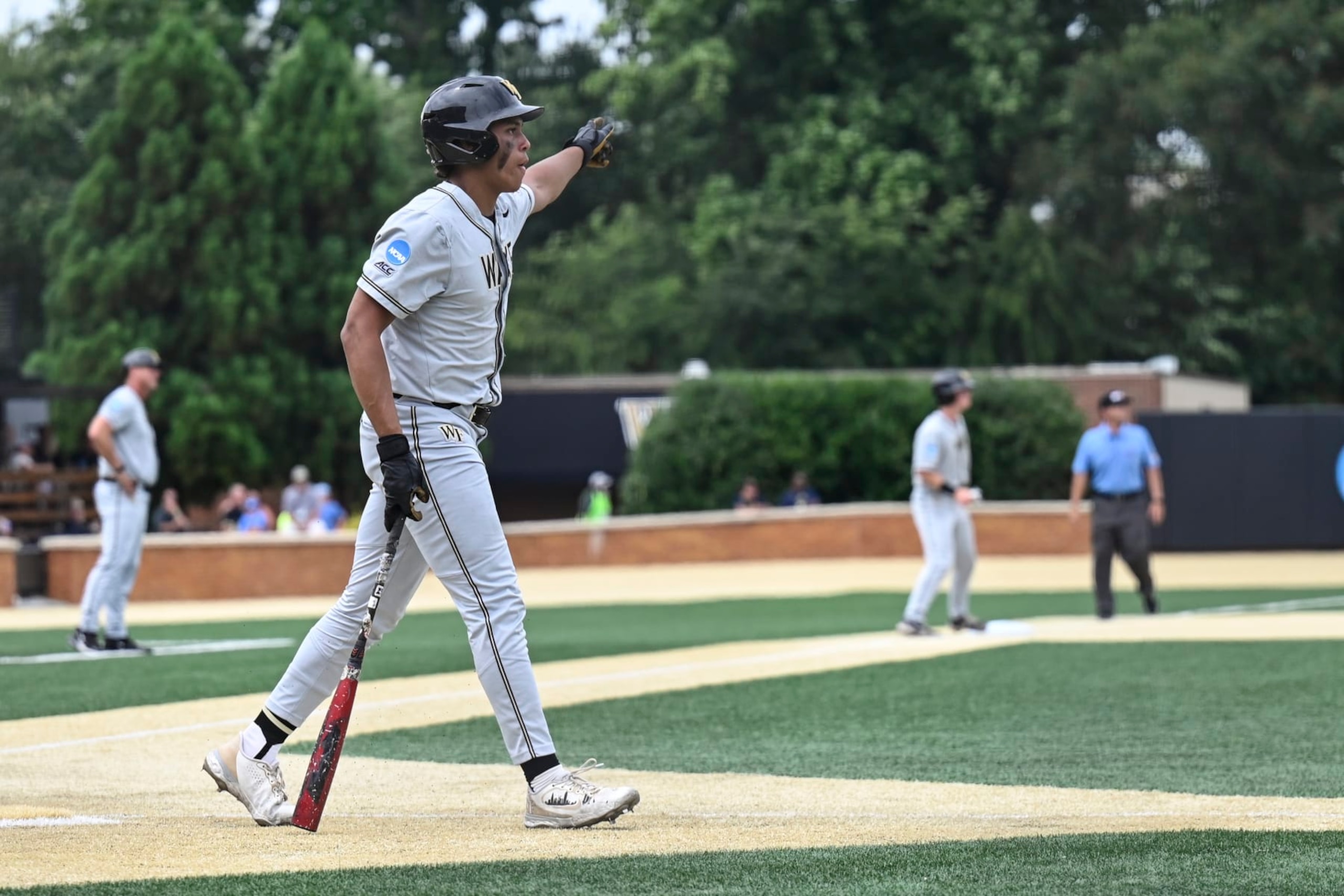 Wake Forest's Danny Corona celebrates after hitting a home run during the ninth inning of an NCAA college baseball tournament super regional game against Alabama, Sunday, June 11, 2023, in Winston-Salem, N.C. (AP Photo/Matt Kelley)
