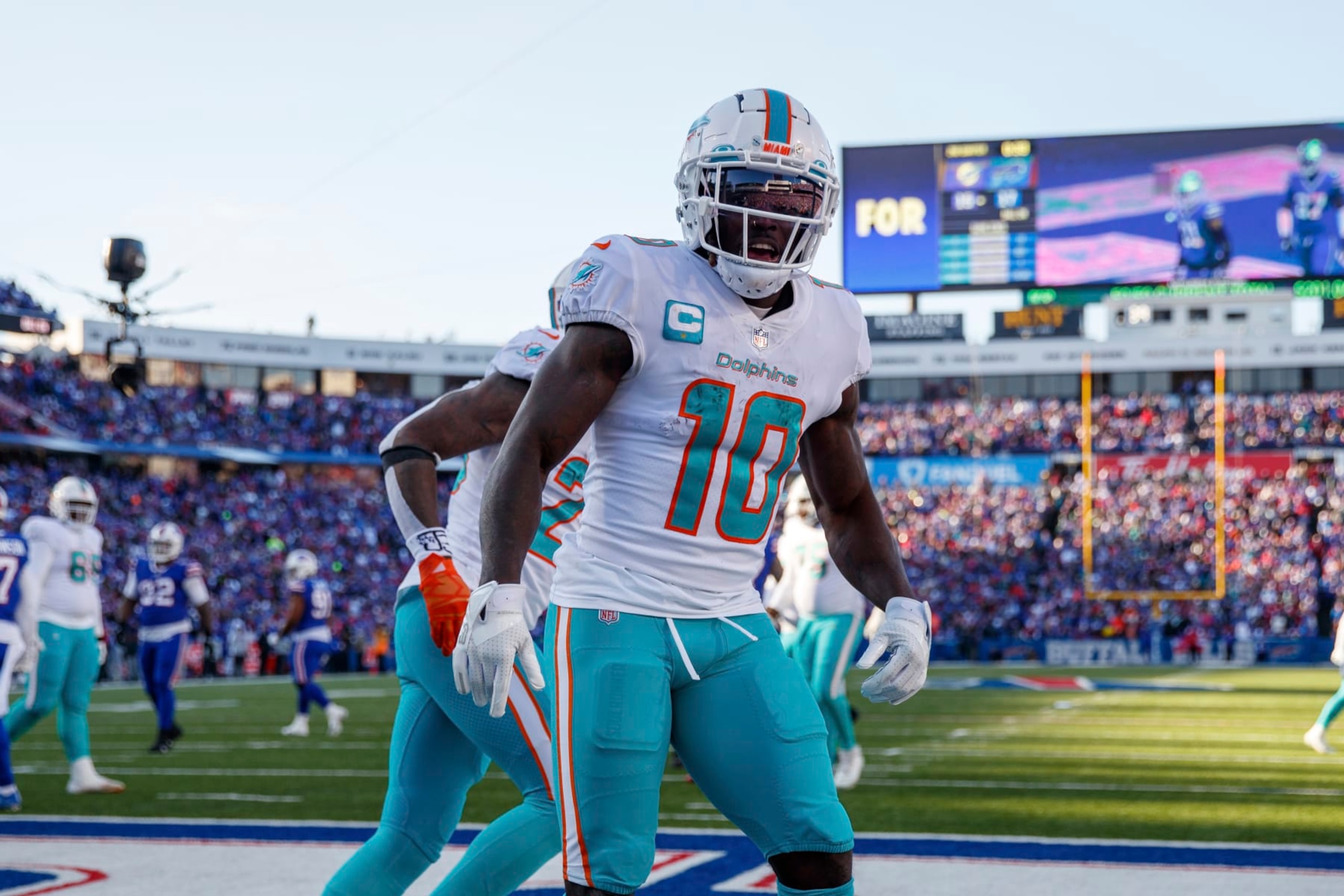 Miami Dolphins wide receiver Tyreek Hill (10) celebrates after catching a two-point conversion during an NFL wild-card football game Sunday, Jan. 15, 2023, in Orchard Park, NY. (AP Photo/Matt Durisko)