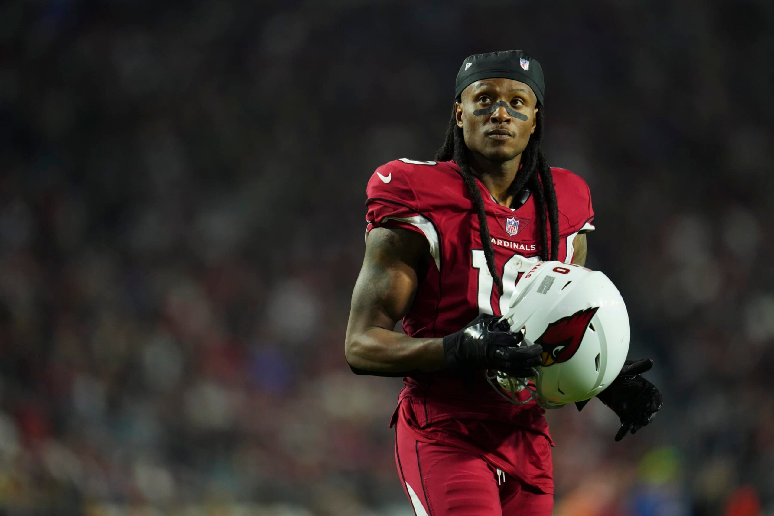 GLENDALE, AZ - DECEMBER 12: DeAndre Hopkins #10 of the Arizona Cardinals gets set against the New England Patriots at State Farm Stadium on December 12, 2022 in Glendale, Arizona. (Photo by Cooper Neill/Getty Images) GLENDALE, AZ - DECEMBER 12: DeAndre Hopkins #10 of the Arizona Cardinals gets set against the New England Patriots at State Farm Stadium on December 12, 2022 in Glendale, Arizona. (Photo by Cooper Neill/Getty Images)