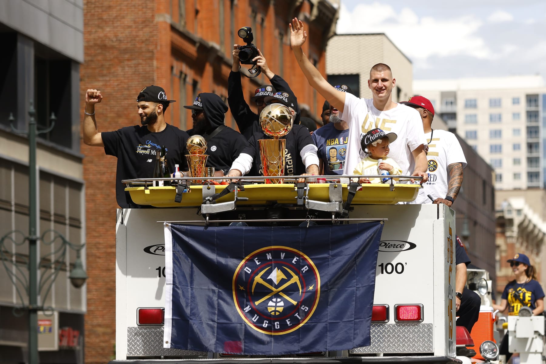 DENVER, COLORADO - JUNE 15: Jamal Murray #27 and Nikola Jokic #15 wave to fans during the Denver Nuggets victory parade and rally after winning the 2023 NBA Championship on June 15, 2023 in Denver, Colorado. NOTE TO USER: User expressly acknowledges and agrees that, by downloading and or using this photograph, User is consenting to the terms and conditions of the Getty Images License Agreement. (Photo by Justin Edmonds/Getty Images)