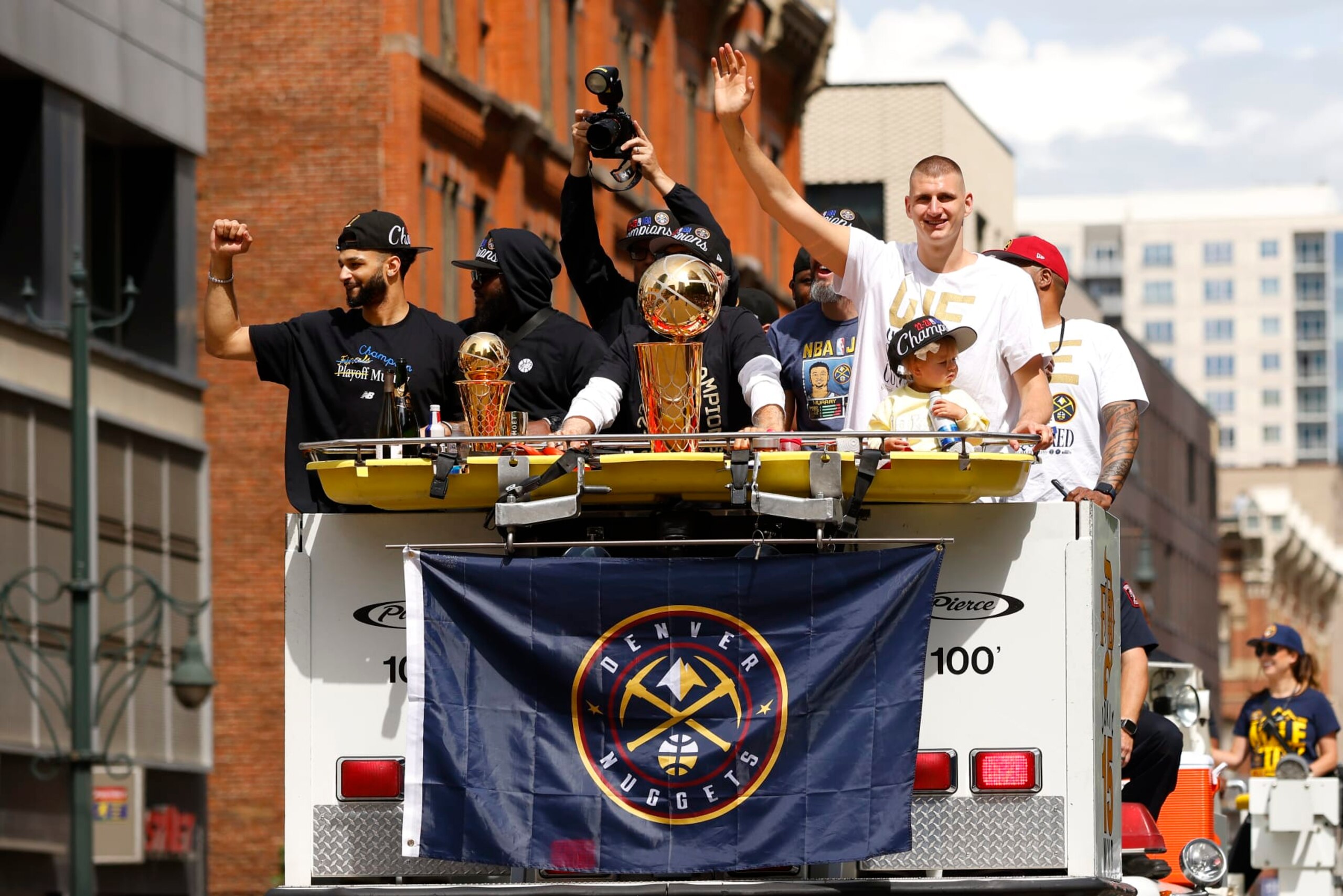 DENVER, COLORADO - JUNE 15: Jamal Murray #27 and Nikola Jokic #15 wave to fans during the Denver Nuggets victory parade and rally after winning the 2023 NBA Championship on June 15, 2023 in Denver, Colorado. NOTE TO USER: User expressly acknowledges and agrees that, by downloading and or using this photograph, User is consenting to the terms and conditions of the Getty Images License Agreement. (Photo by Justin Edmonds/Getty Images) DENVER, COLORADO - JUNE 15: Jamal Murray #27 and Nikola Jokic #15 wave to fans during the Denver Nuggets victory parade and rally after winning the 2023 NBA Championship on June 15, 2023 in Denver, Colorado. NOTE TO USER: User expressly acknowledges and agrees that, by downloading and or using this photograph, User is consenting to the terms and conditions of the Getty Images License Agreement. (Photo by Justin Edmonds/Getty Images)