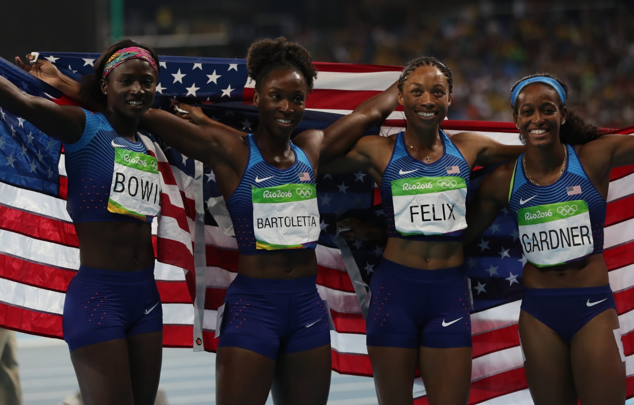 RIO DE JANEIRO, BRAZIL - AUGUST 19: English Gardner, Allyson Felix, Tianna Bartoletta and Tori Bowie of the United States celebrate winning gold in the Women's 4 x 100m Relay Final on Day 14 of the Rio 2016 Olympic Games at the Olympic Stadium on August 19, 2016 in Rio de Janeiro, Brazil. (Photo by Ian MacNicol/Getty Images)