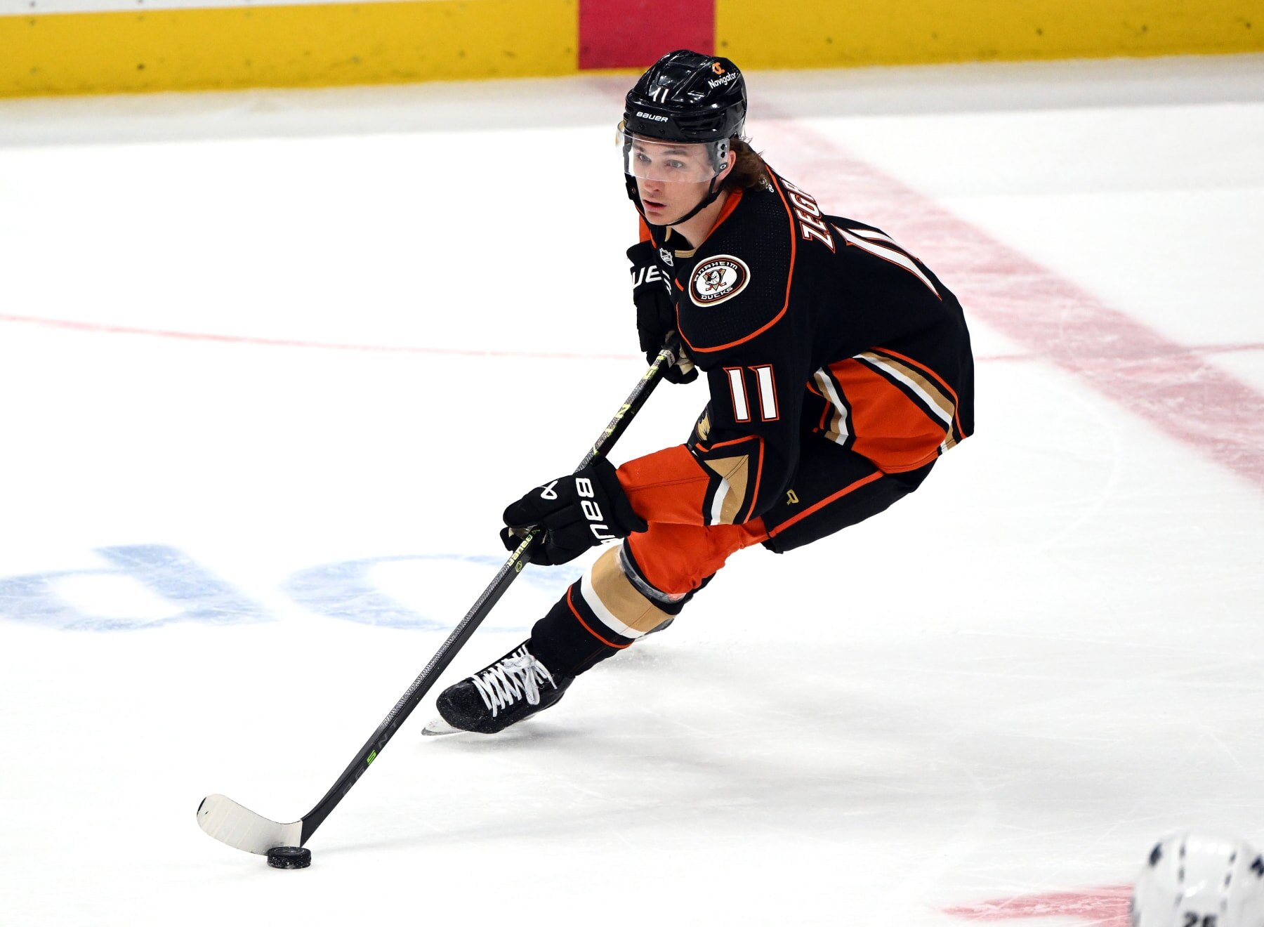 ANAHEIM, CA - APRIL 13: Anaheim Ducks center Trevor Zegras (11) with the puck during an NHL hockey game against the Los Angeles Kings played on April 13, 2023 at the Honda Center in Anaheim, CA. (Photo by John Cordes/Icon Sportswire via Getty Images)
