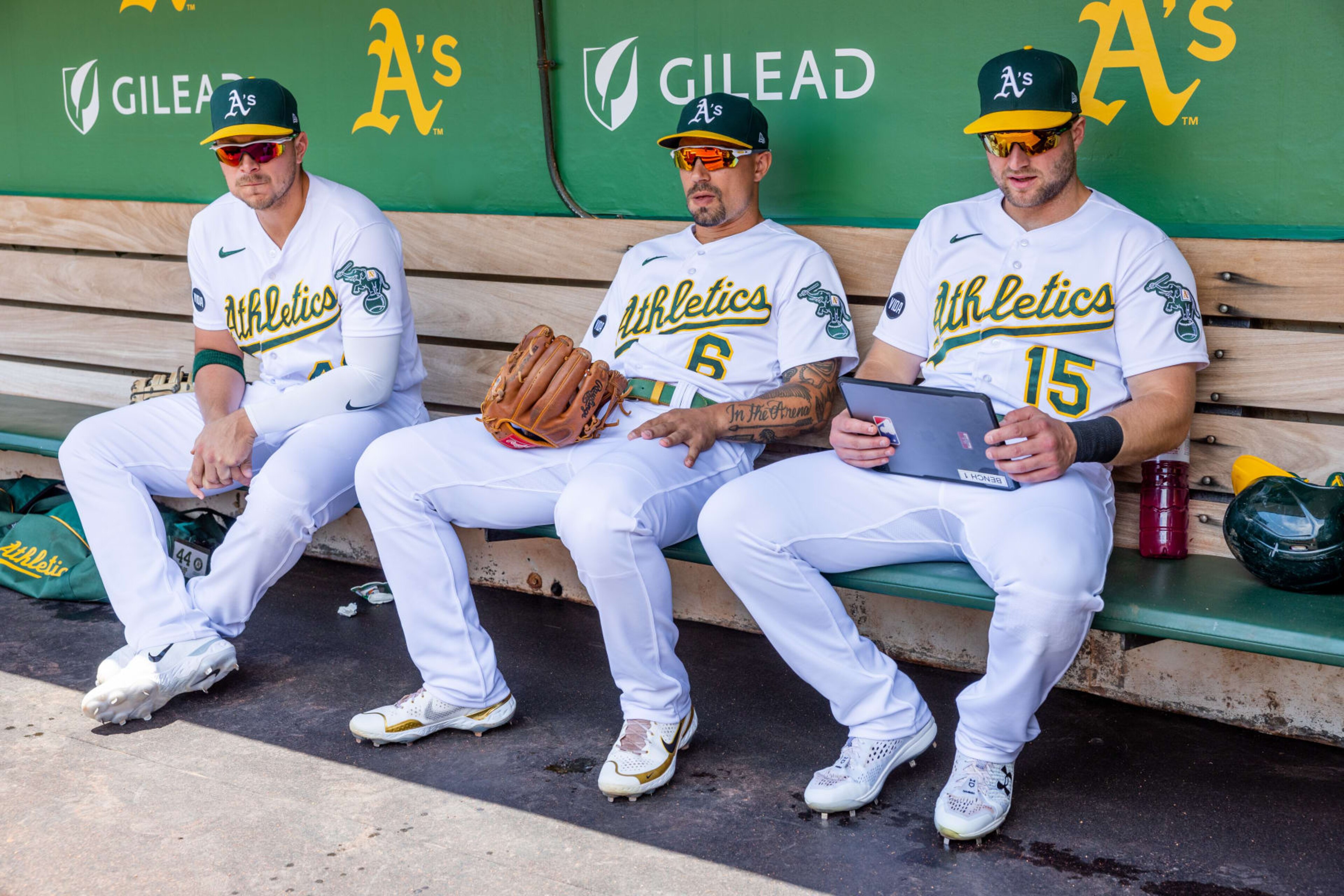OAKLAND, CA - JUNE 15: Oakland Athletics First base Ryan Noda (49) Oakland Athletics Infield Jace Peterson (6) and Oakland Athletics Designated hitter Seth Brown (15) relax in the dugout before the Major League Baseball game between the Tampa Bay Rays and the Oakland Athletics on June 15, 2023 at RingCentral Coliseum in Oakland, CA. (Photo by Bob Kupbens/Icon Sportswire via Getty Images)