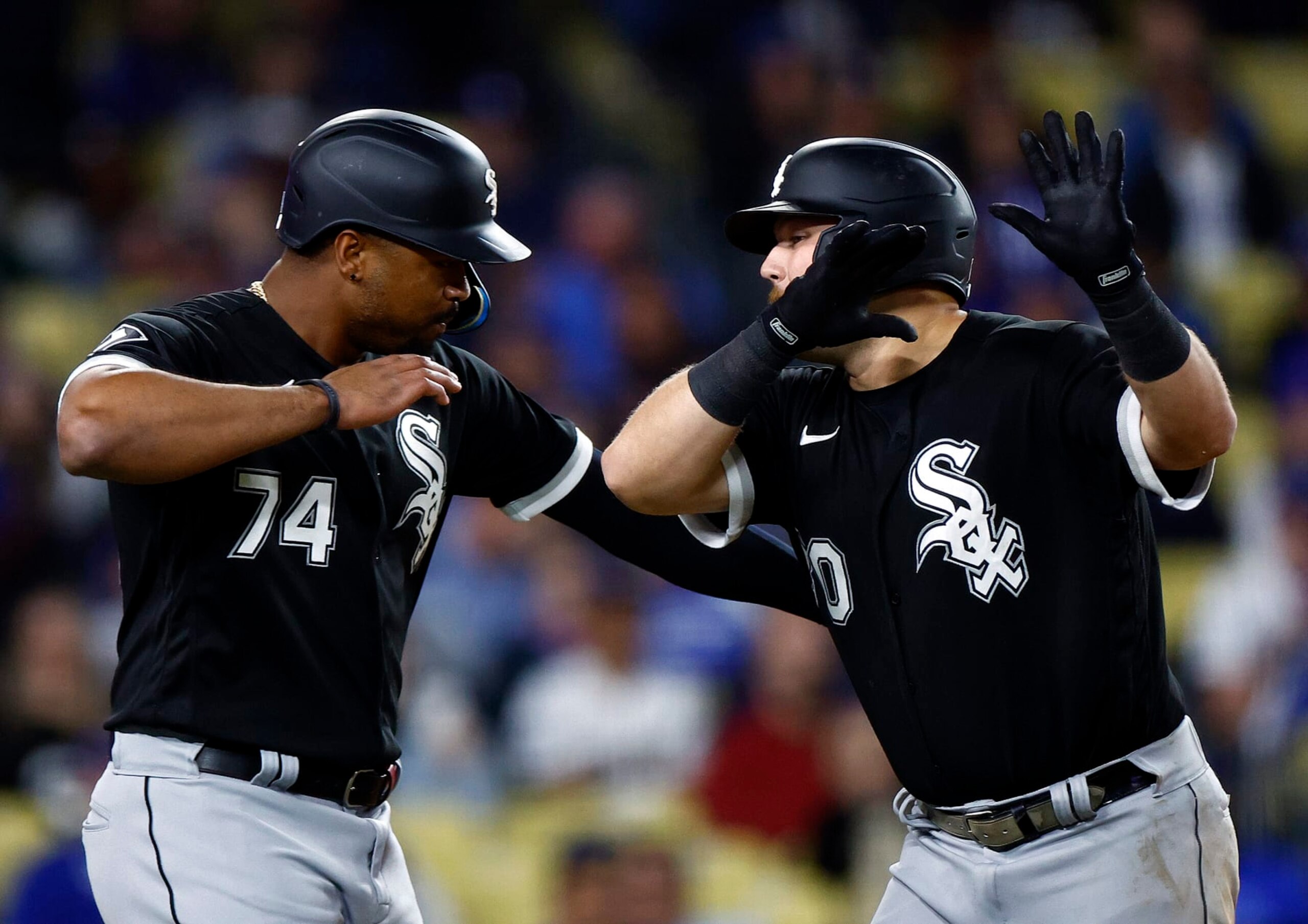 LOS ANGELES, CALIFORNIA - JUNE 14: Jake Burger #30 of the Chicago White Sox celebrates a two-run home run with Eloy Jimenez #74 against the Los Angeles Dodgers in the eighth inning at Dodger Stadium on June 14, 2023 in Los Angeles, California. (Photo by Ronald Martinez/Getty Images) LOS ANGELES, CALIFORNIA - JUNE 14: Jake Burger #30 of the Chicago White Sox celebrates a two-run home run with Eloy Jimenez #74 against the Los Angeles Dodgers in the eighth inning at Dodger Stadium on June 14, 2023 in Los Angeles, California. (Photo by Ronald Martinez/Getty Images)