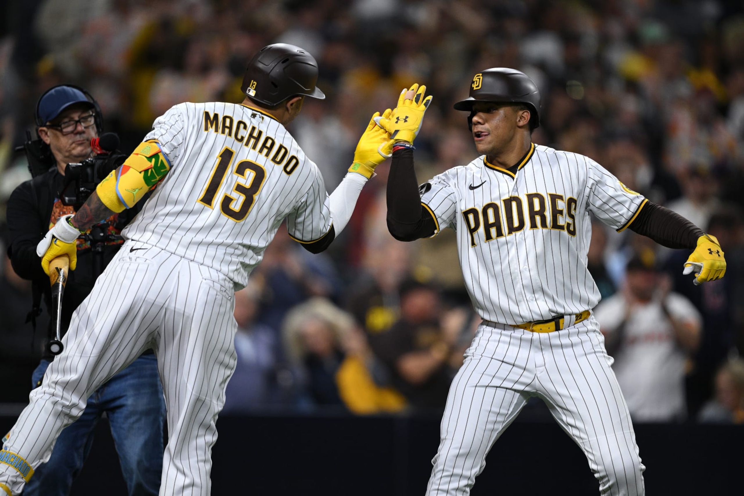 SAN DIEGO, CALIFORNIA - JUNE 14: Juan Soto #22 of the San Diego Padres is congratulated by Manny Machado #13 after hitting a home run against the Cleveland Guardians during the sixth inning at PETCO Park on June 14, 2023 in San Diego, California. (Photo by Orlando Ramirez/Getty Images) SAN DIEGO, CALIFORNIA - JUNE 14: Juan Soto #22 of the San Diego Padres is congratulated by Manny Machado #13 after hitting a home run against the Cleveland Guardians during the sixth inning at PETCO Park on June 14, 2023 in San Diego, California. (Photo by Orlando Ramirez/Getty Images)