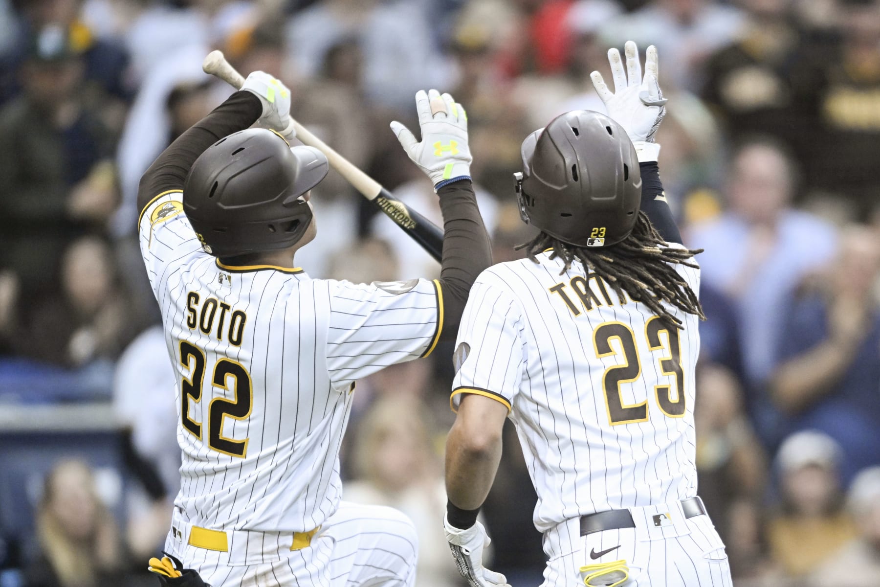SAN DIEGO, CA - JUNE 13: Fernando Tatis Jr. #23 and Juan Soto #22 of the San Diego Padres celebrate after Tatis's solo home run in the third inning against the Cleveland Guardians June 13, 2023 at Petco Park in San Diego, California. (Photo by Denis Poroy/Getty Images)